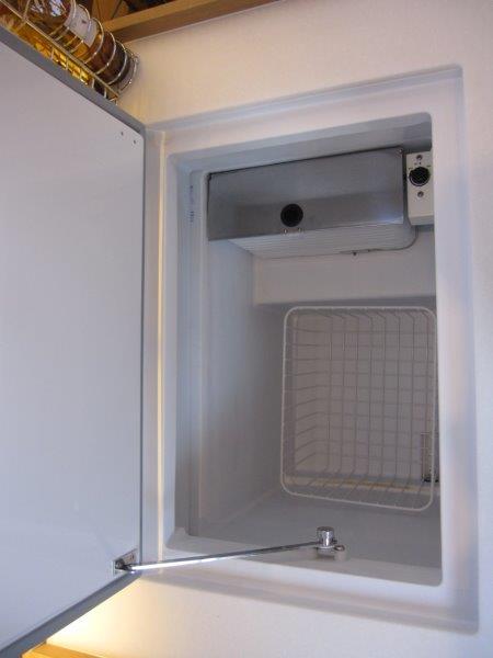 Built-in refrigerator in Jeanneau 380 sailboat, 2024 model.