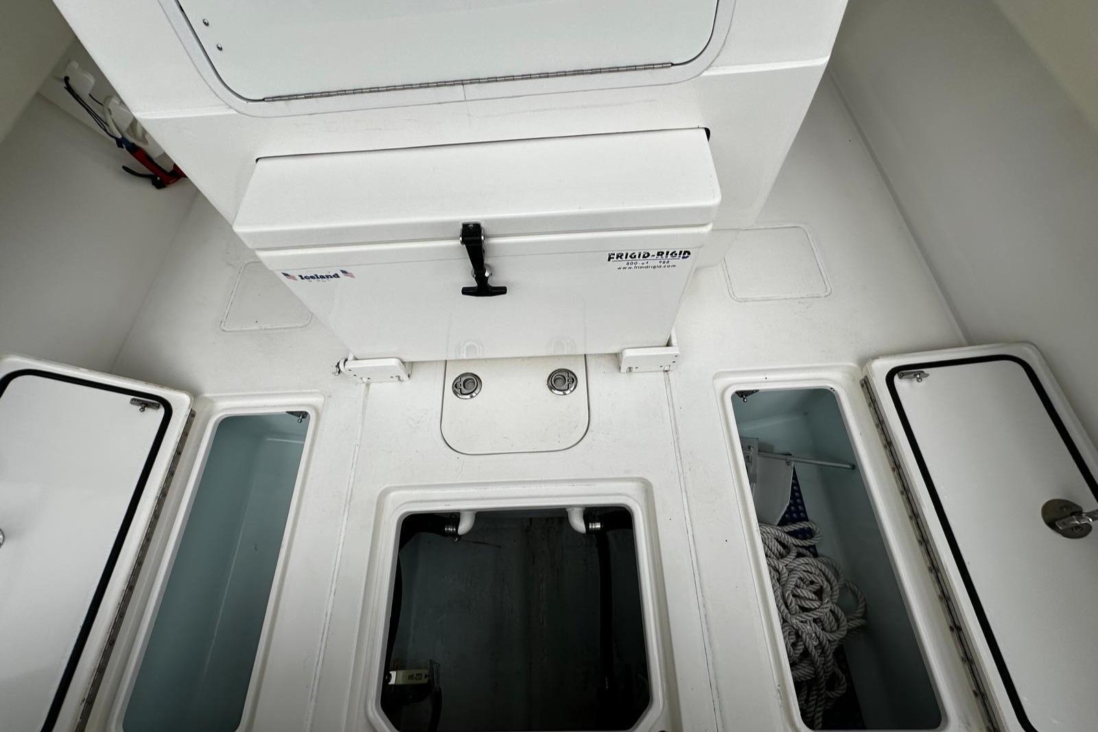2013 Contender 30 ST boat storage compartments and hatches, interior view.