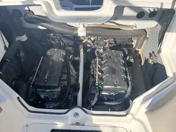 2010 Yamaha Boats 242 Limited engine compartment with dual engines visible.