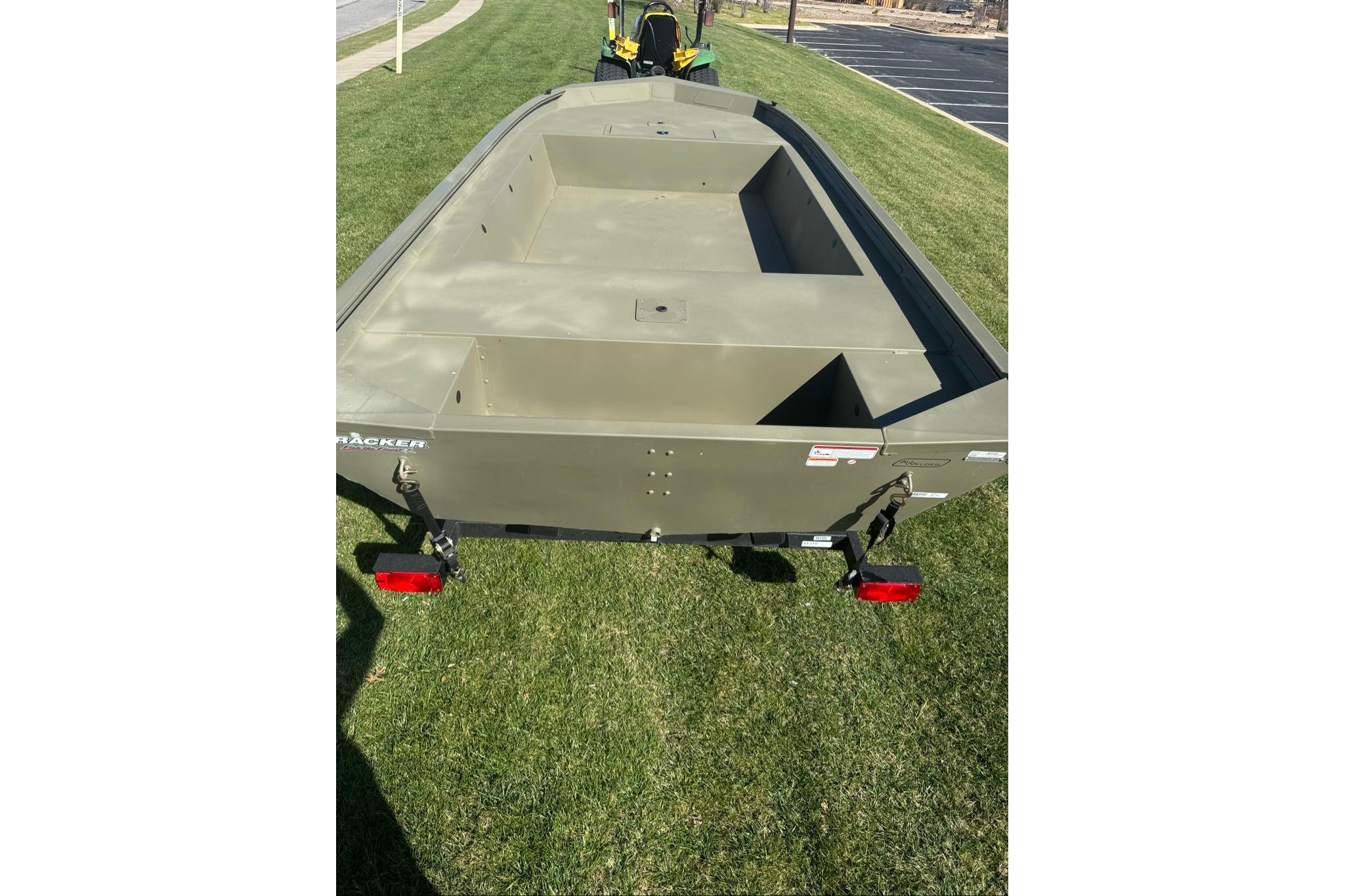 2026 Tracker Grizzly 1754 Utility boat on grass, rear view.
