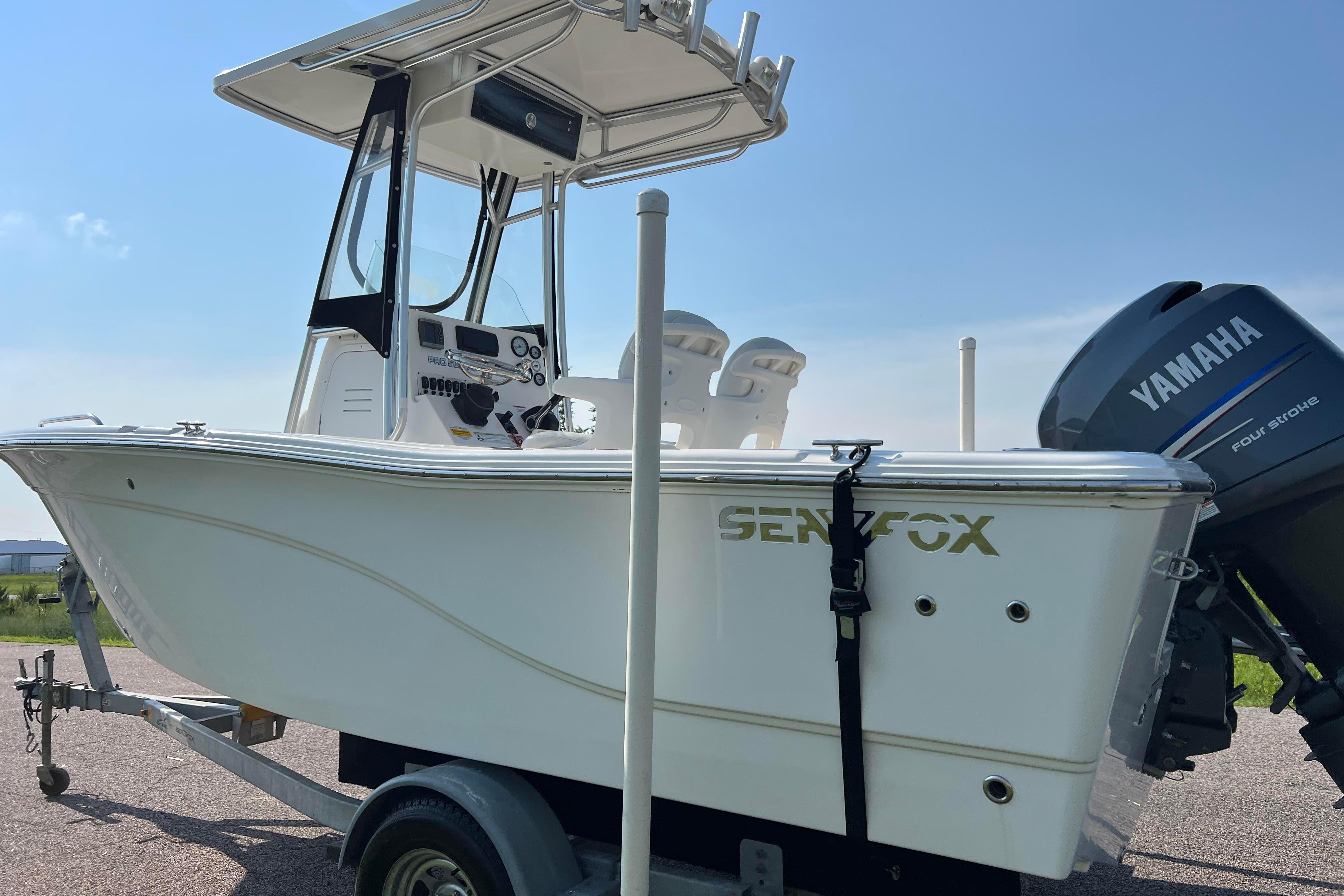2012 Sea Fox 206 Center Console boat on trailer with Yamaha outboard motor.