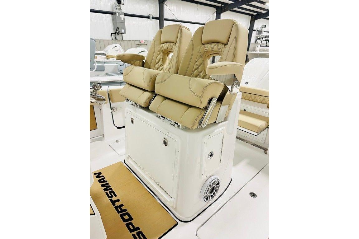 2026 Sportsman Open 262 Center Console boat seats with tan upholstery and armrests.