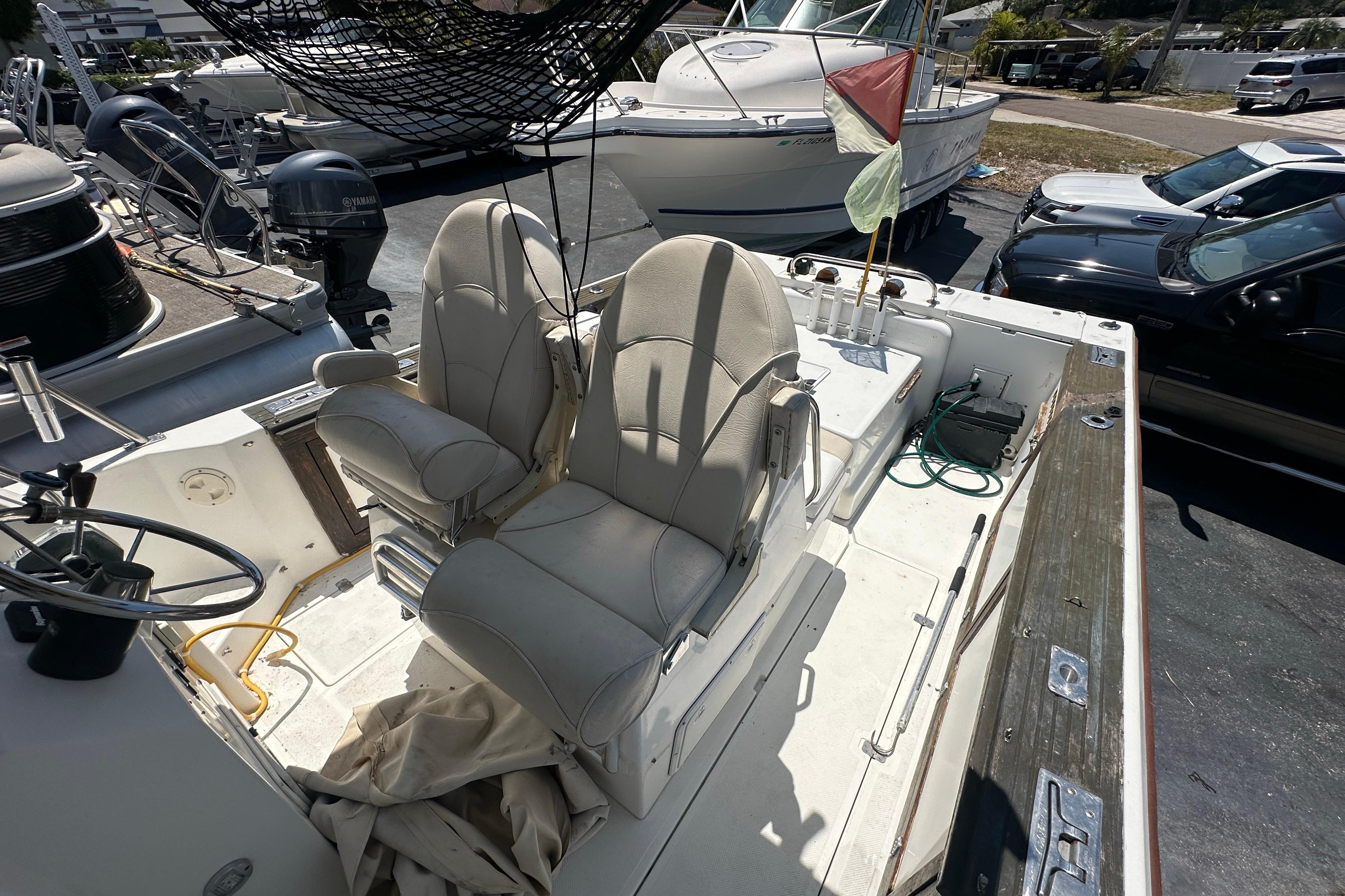 1998 True World Marine TE286 boat interior with dual seats and steering wheel.