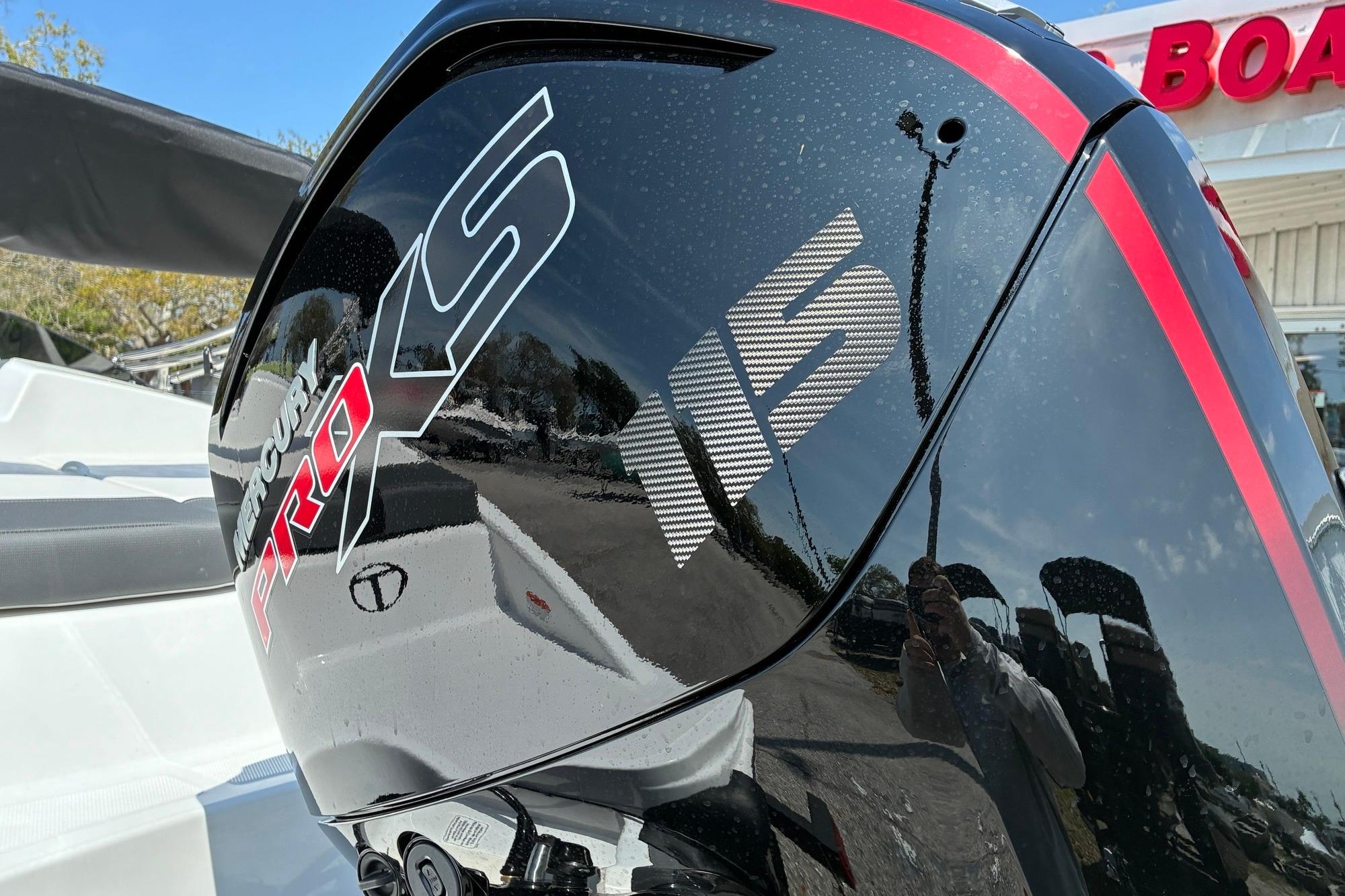 Mercury Pro XS engine on a 2026 Tahoe T18 boat, reflecting outdoor surroundings.