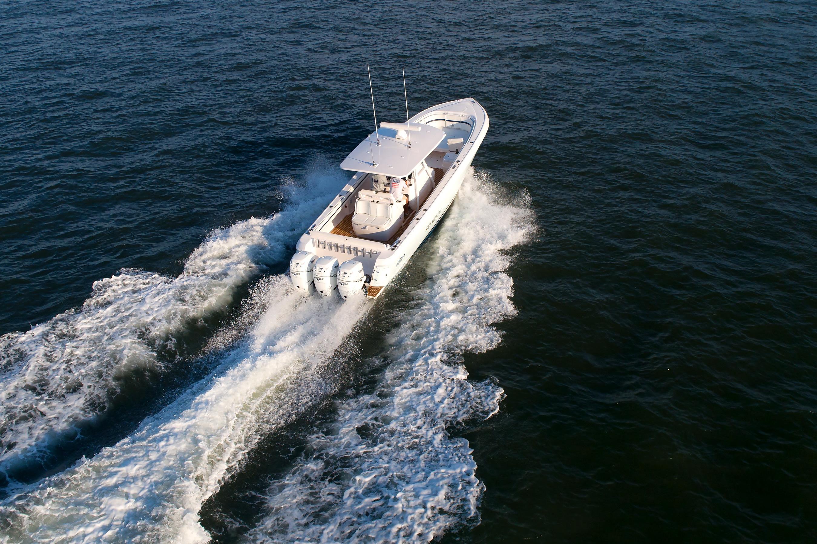2017 Intrepid 375 Nomad FE cruising on open water, aerial view.