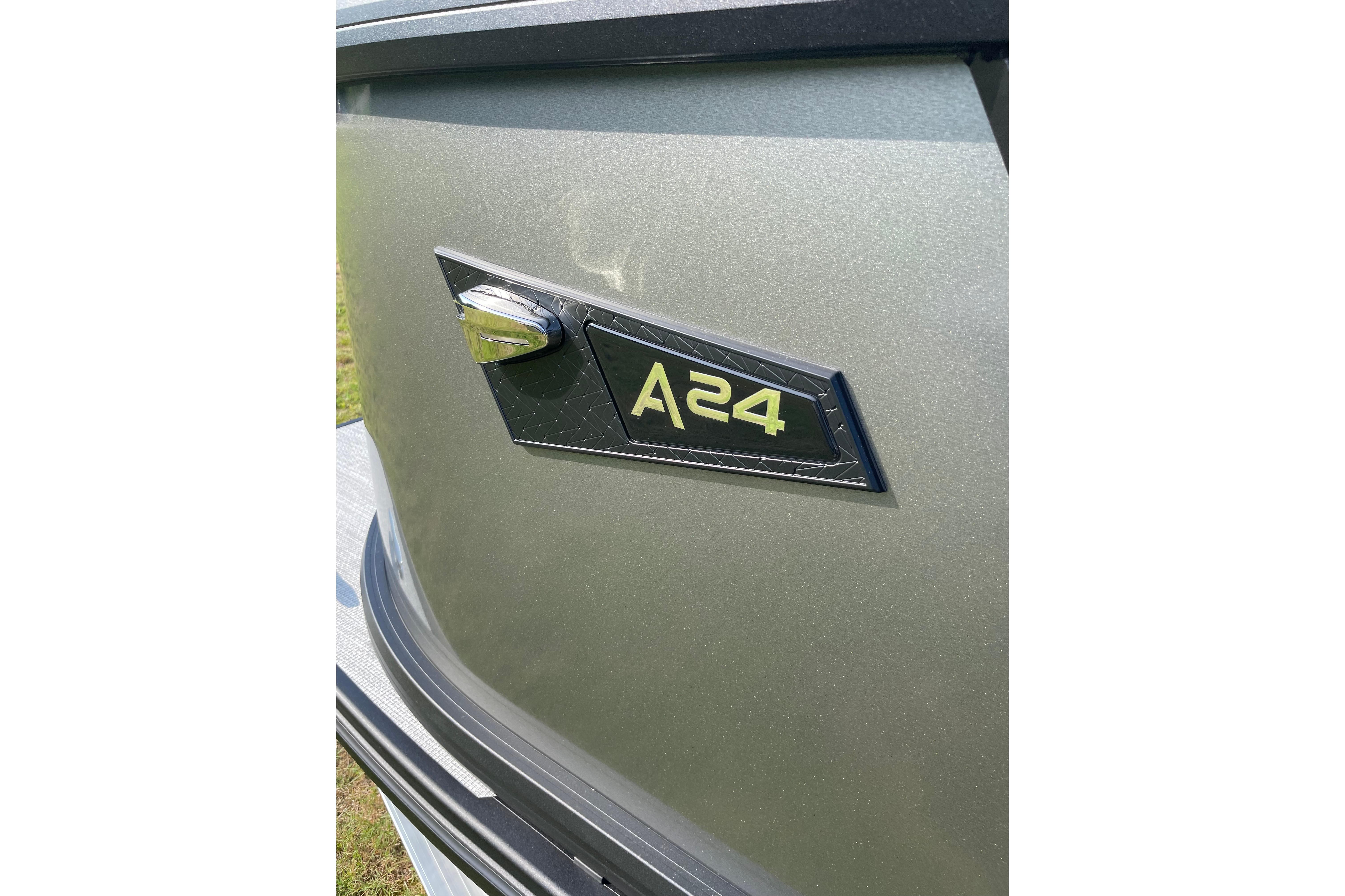 Close-up of 2027 Alera A24 model badge on metallic surface.