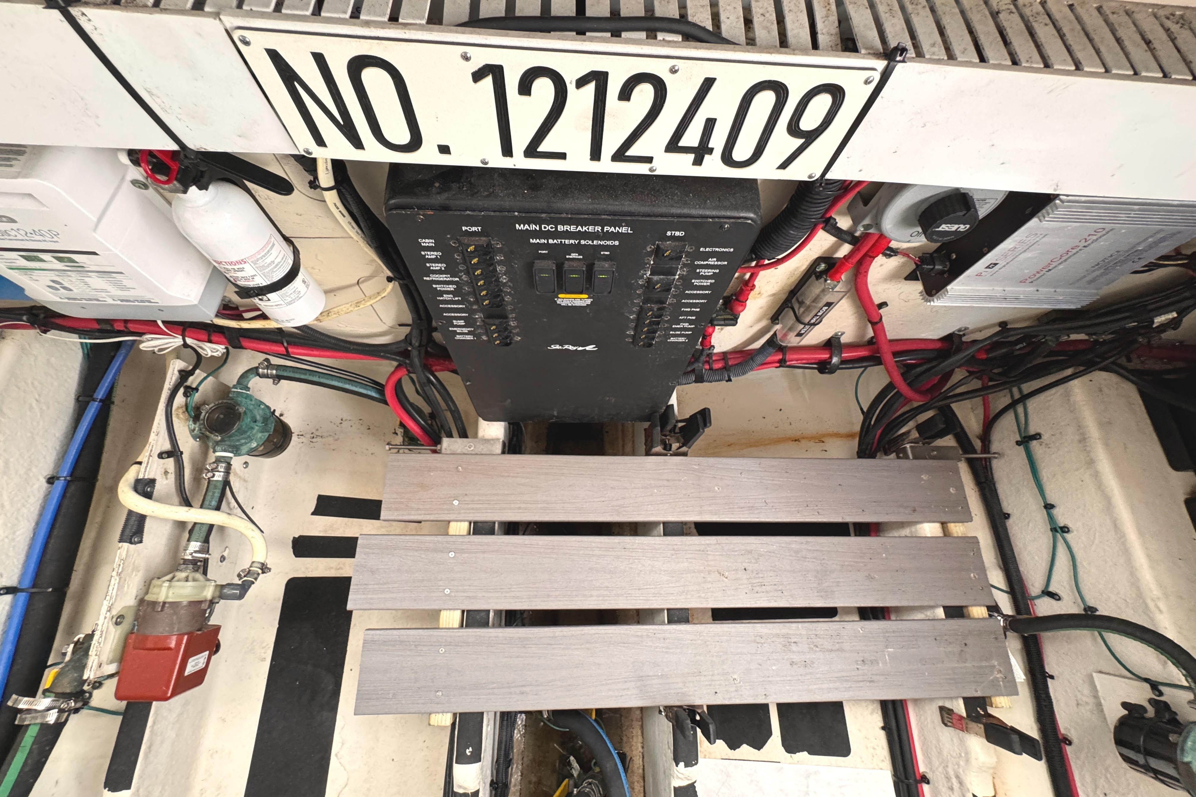Engine compartment of 2008 Sea Ray Sundancer 350 with wiring and control panel.