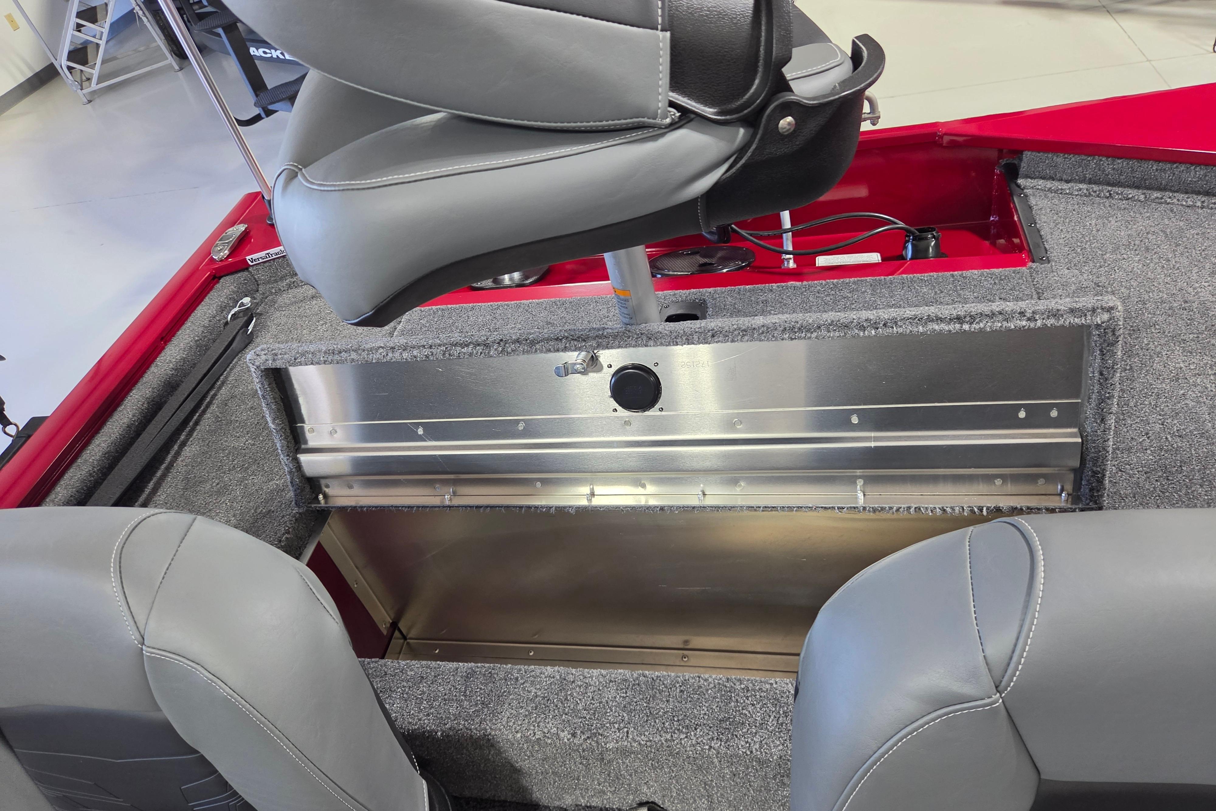 2026 Tracker Pro 170 boat interior with gray seating and storage compartment.