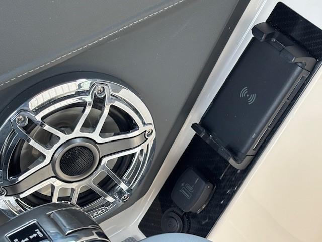 Speaker and wireless charging pad on 2026 Chaparral SSX 6 boat dashboard.