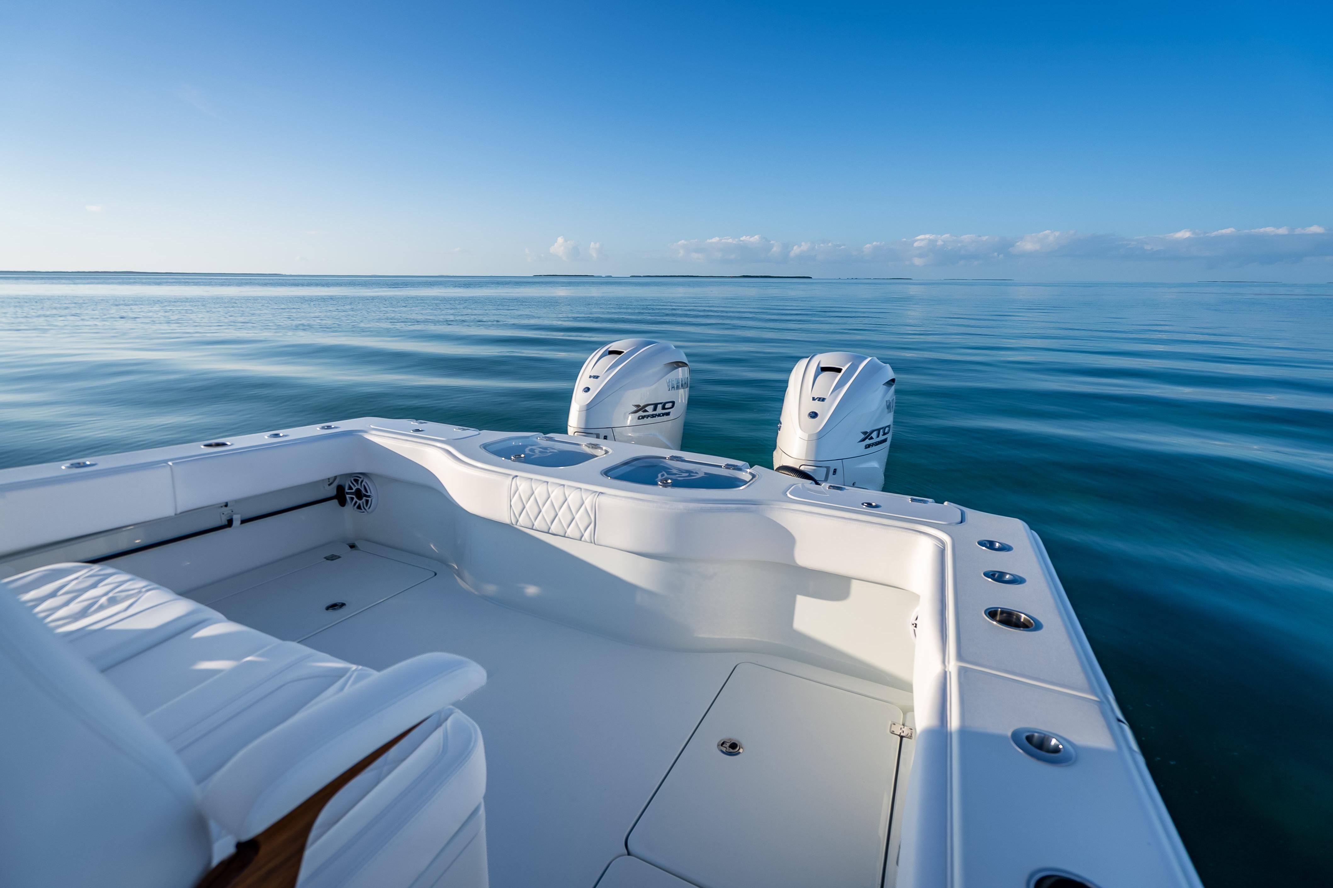 Freeman 35 boat, 2026 model, on calm ocean waters under clear blue sky.