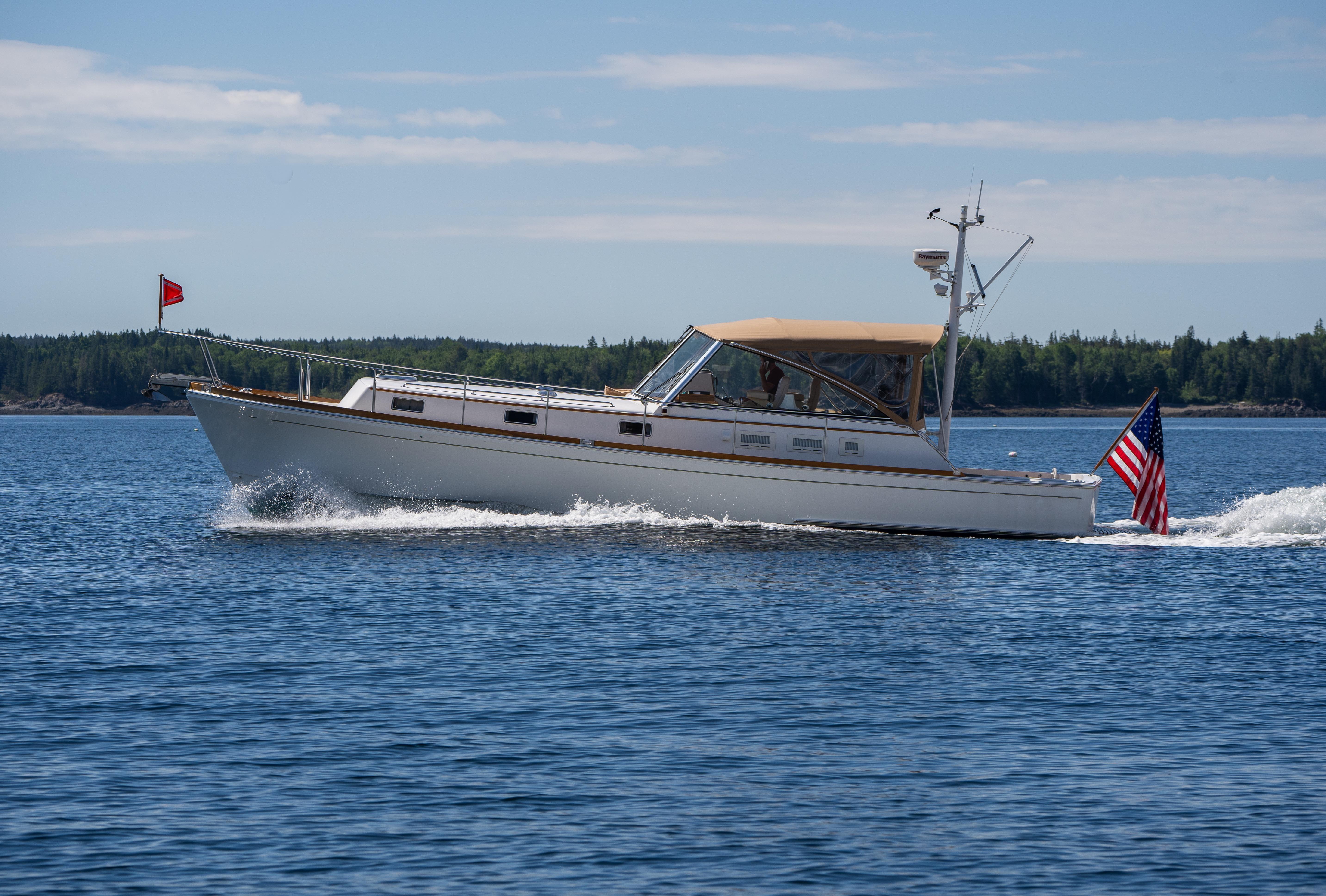2000 Grand Banks Eastbay 43 Ex cruising on open water.