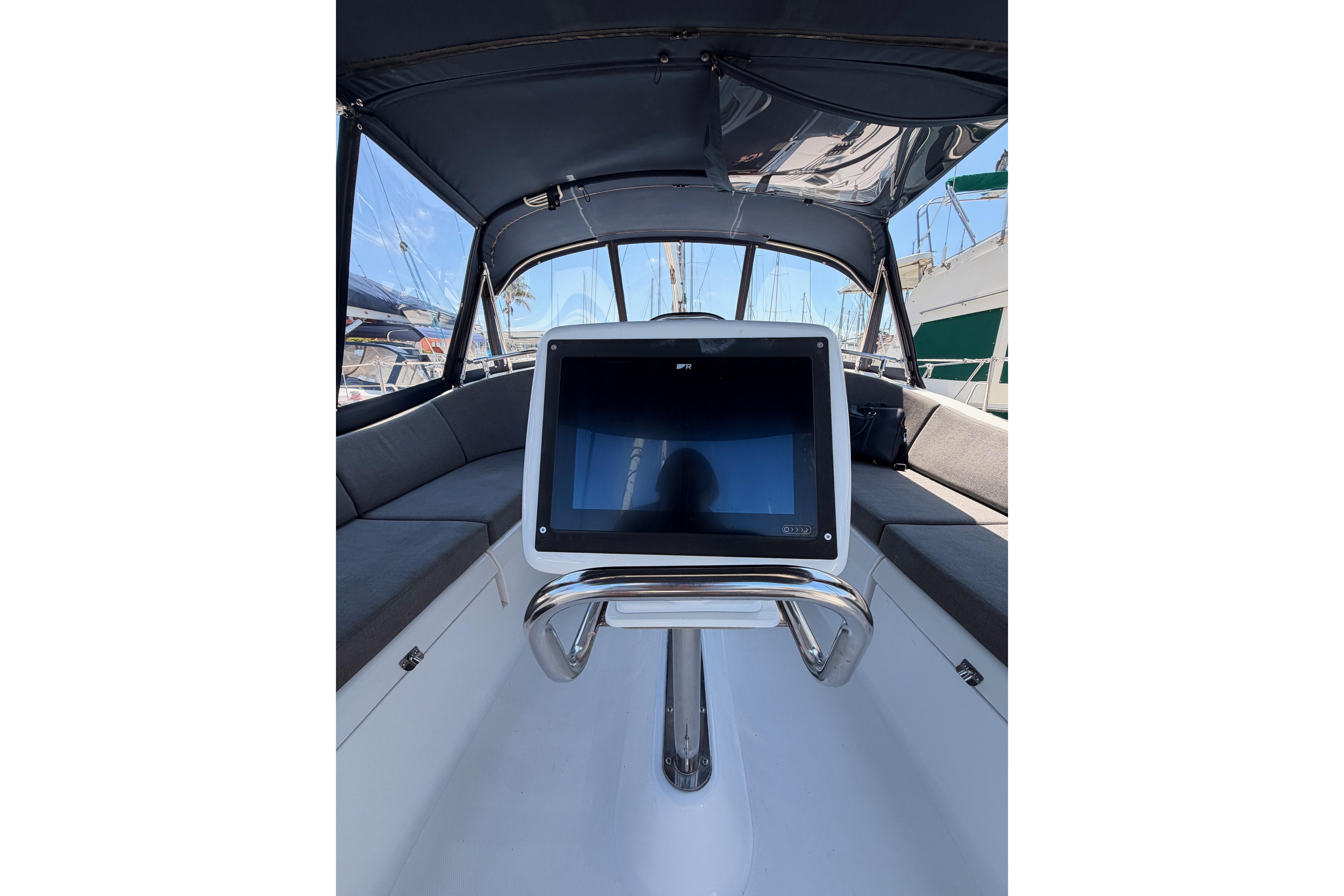 Interior view of 2008 Hunter 45 Deck Salon yacht cockpit with navigation display.