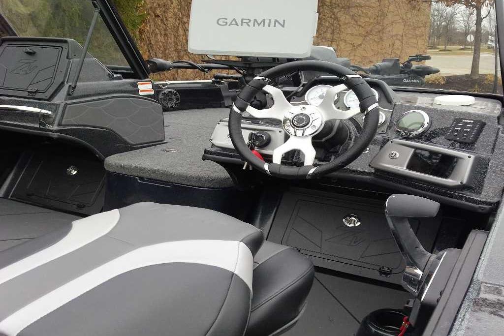 Interior of 2026 Nitro ZV20 Pro boat with Garmin navigation system and modern steering wheel.