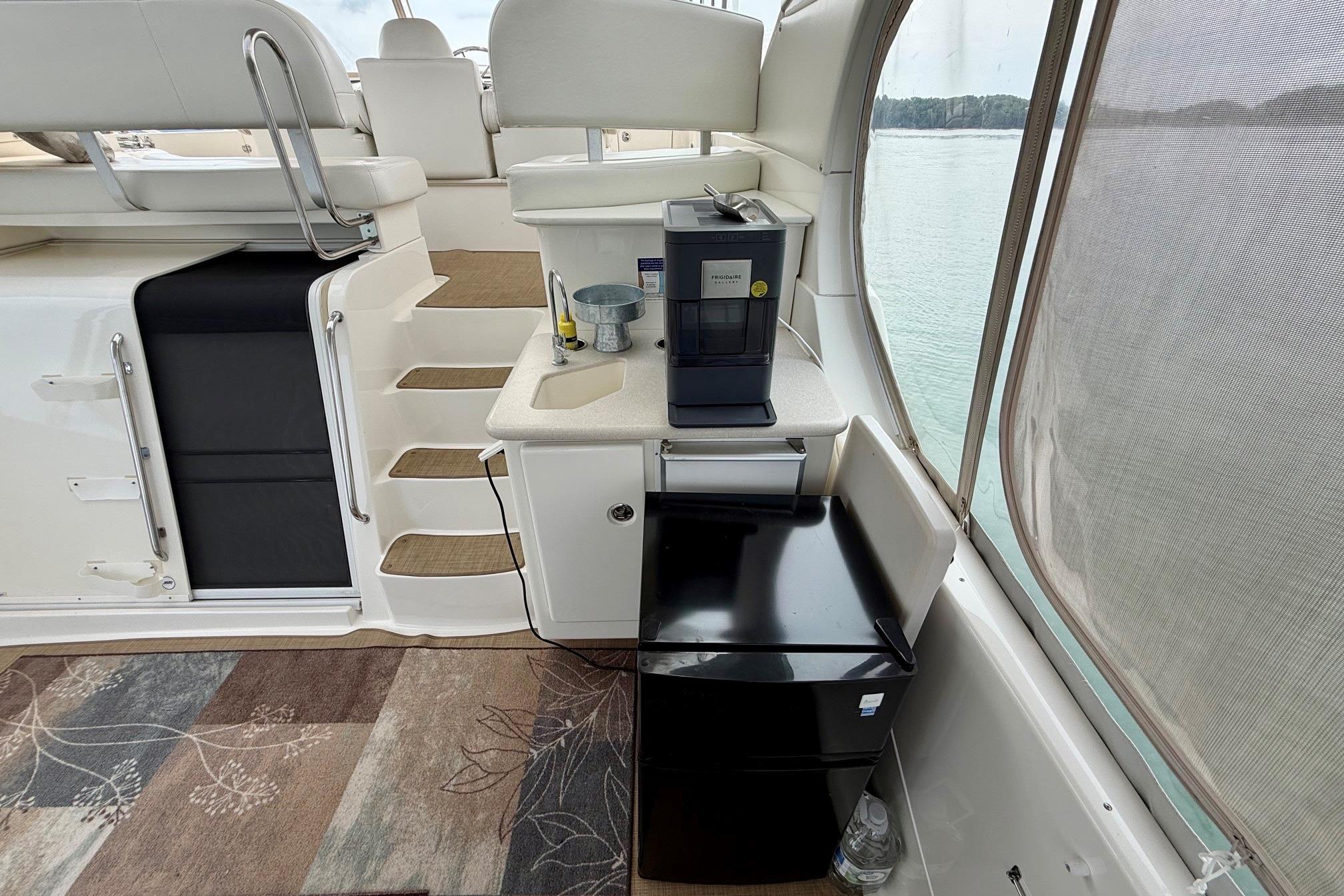 Interior of 2004 Silverton 39 Motor Yacht with kitchenette and seating area.