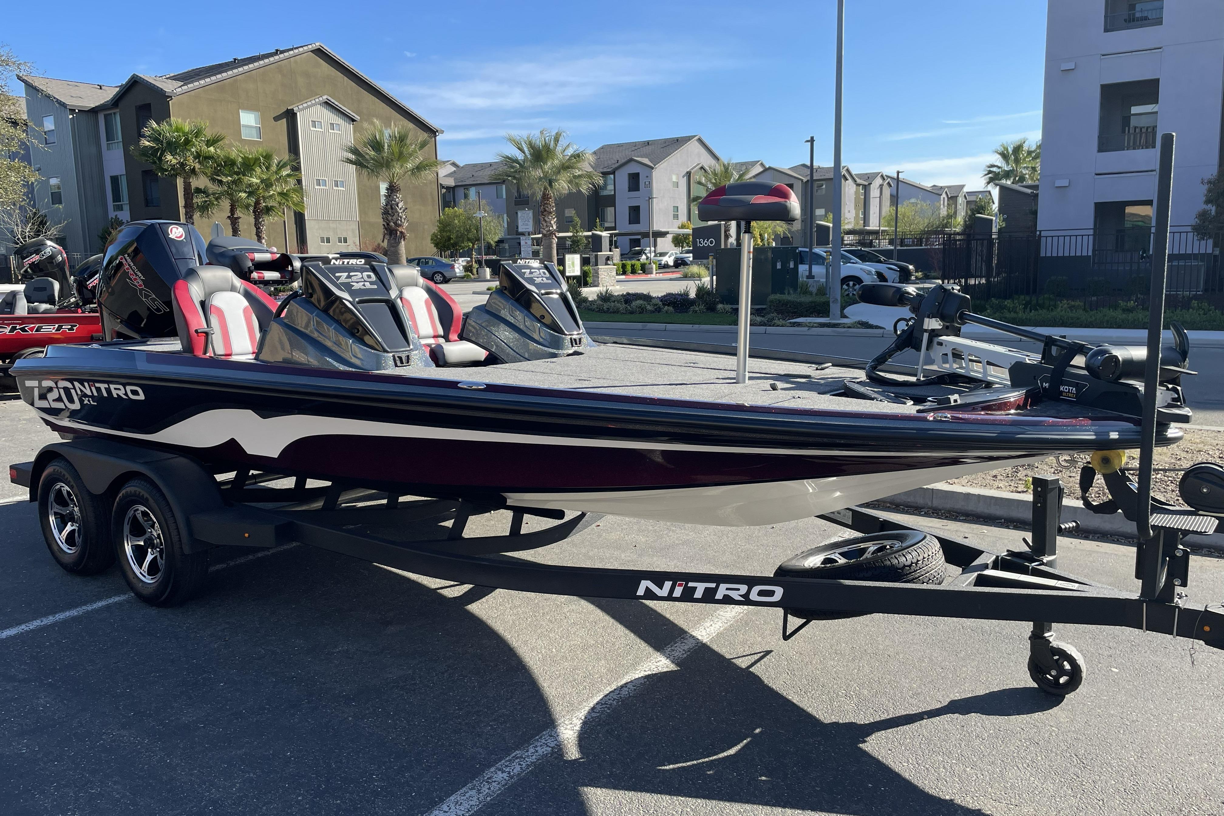 2026 Nitro Z20 XL boat on trailer in urban setting, showcasing sleek design.