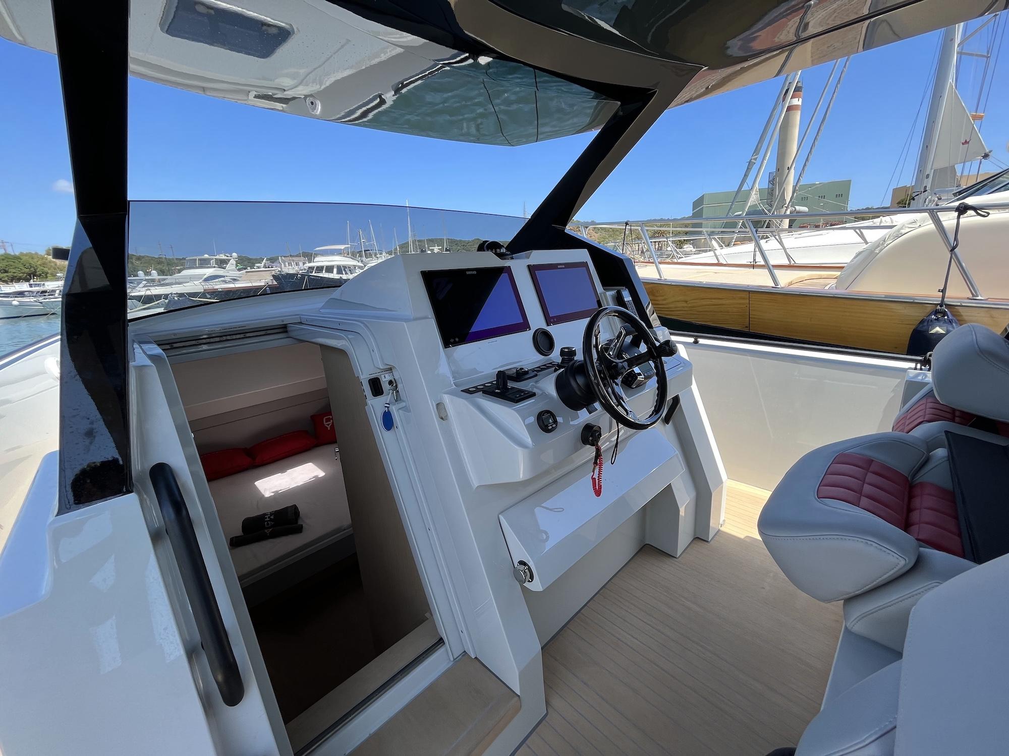 2023 Chaser 54 Laguna boat cockpit with modern controls and luxurious seating.