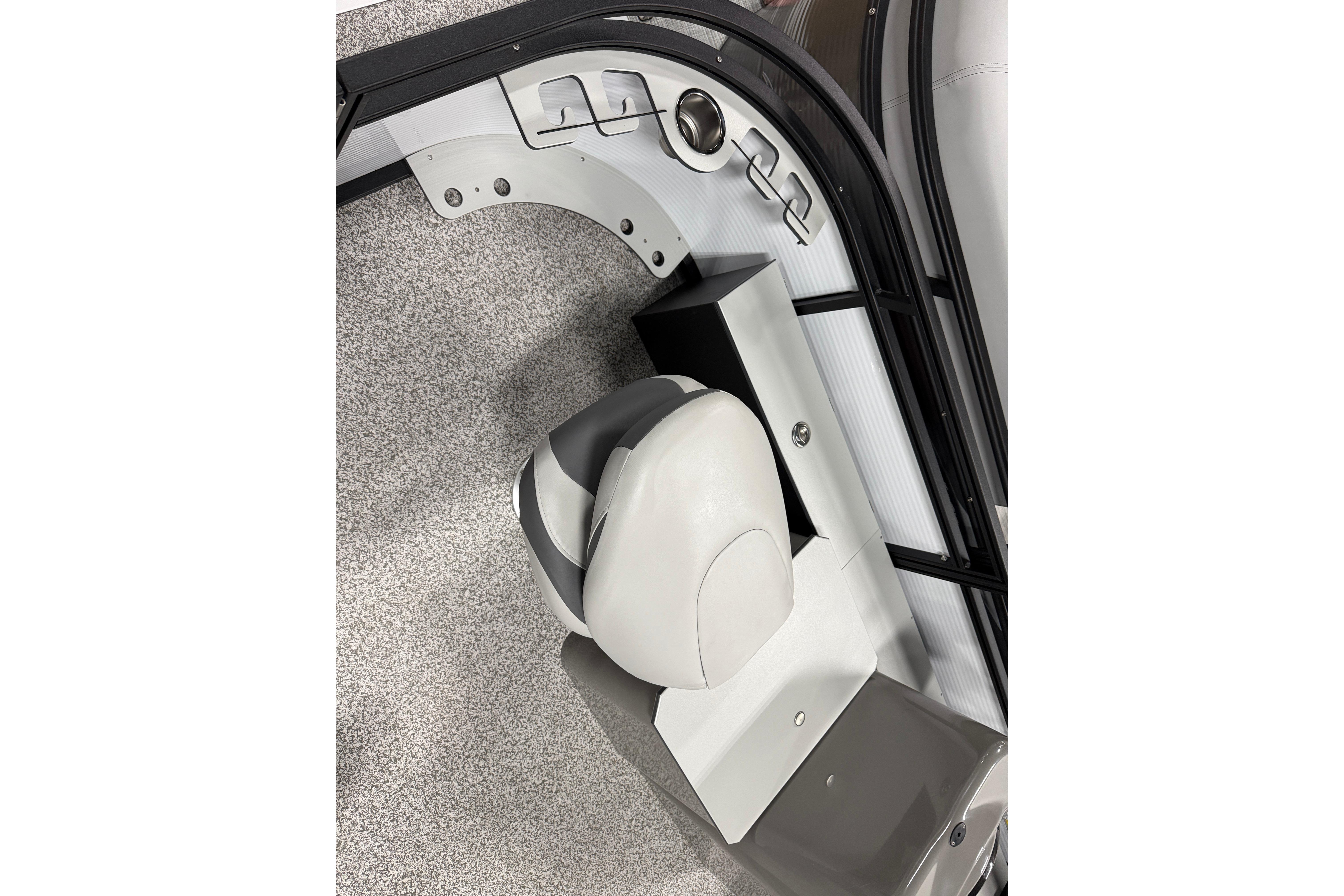 Interior view of 2026 Angler Quest 816 Panfish boat with seating and control panel.