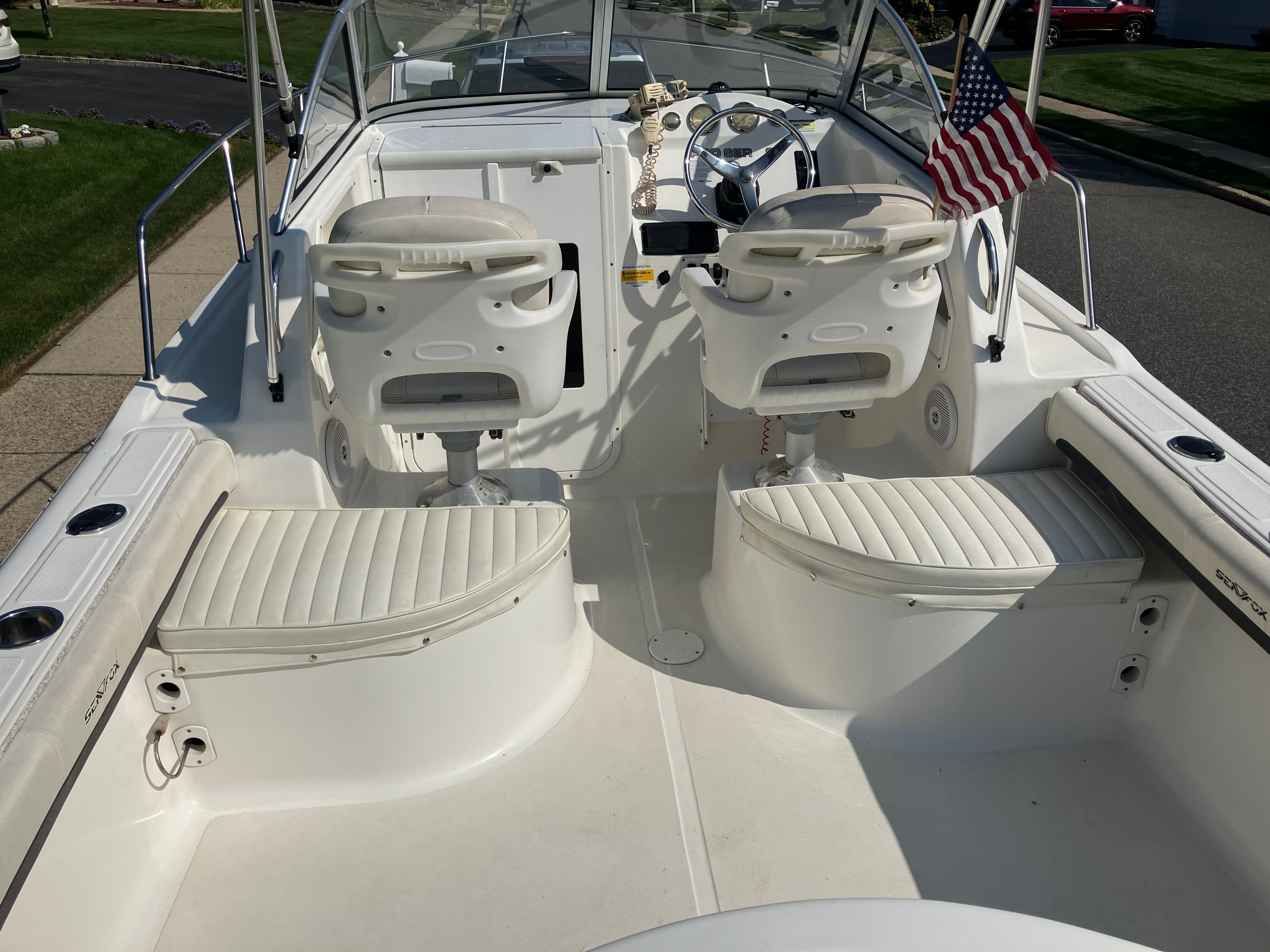 Interior of a Custom 216wa pro boat, 2010 model, featuring white seating.