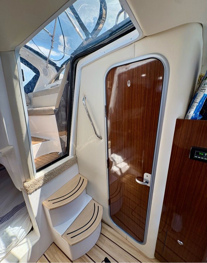 Interior of the Regal 30 Express with wooden door and steps.