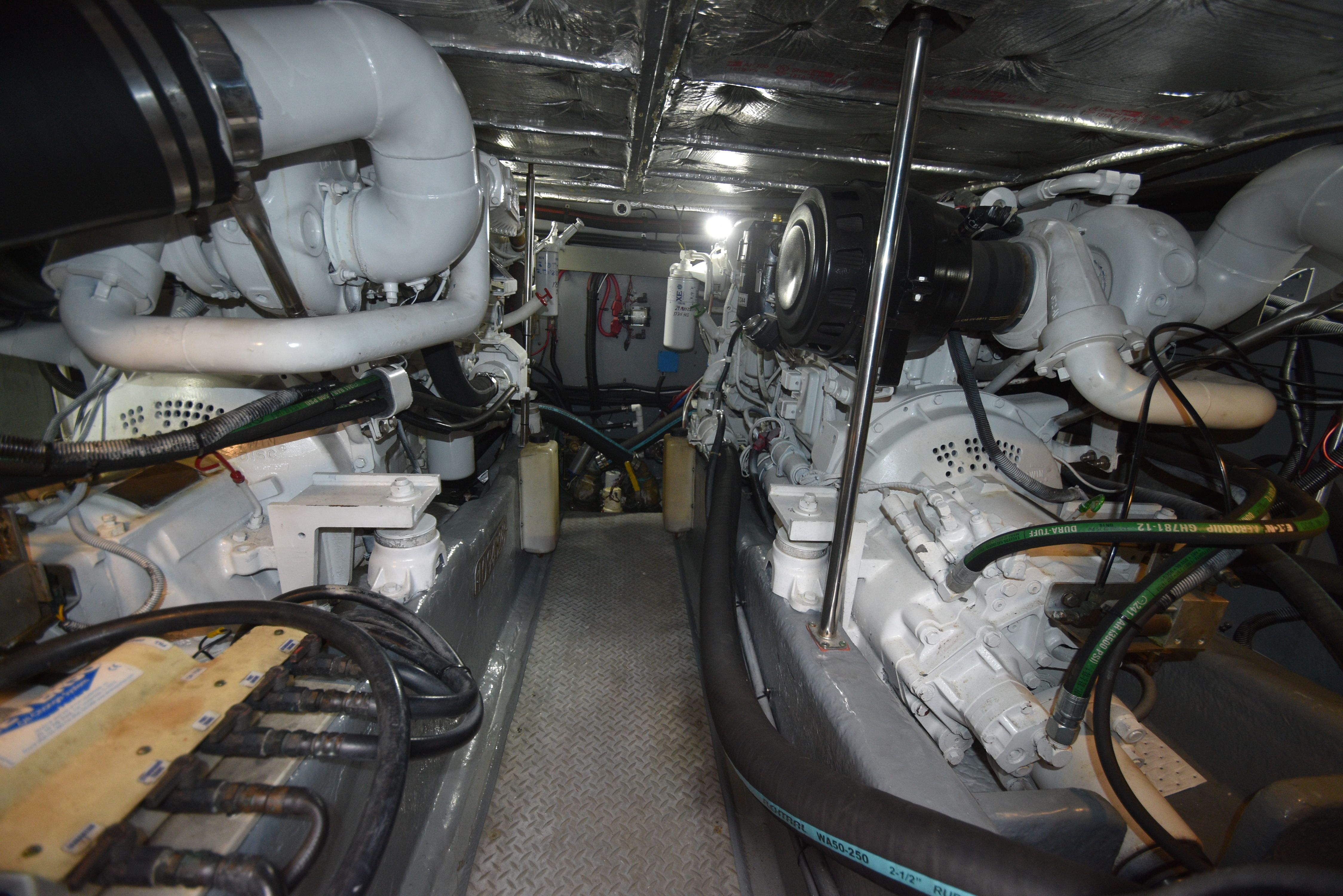 Engine room of the 2000 Sea Ray 480 Sedan Bridge with two large engines.
