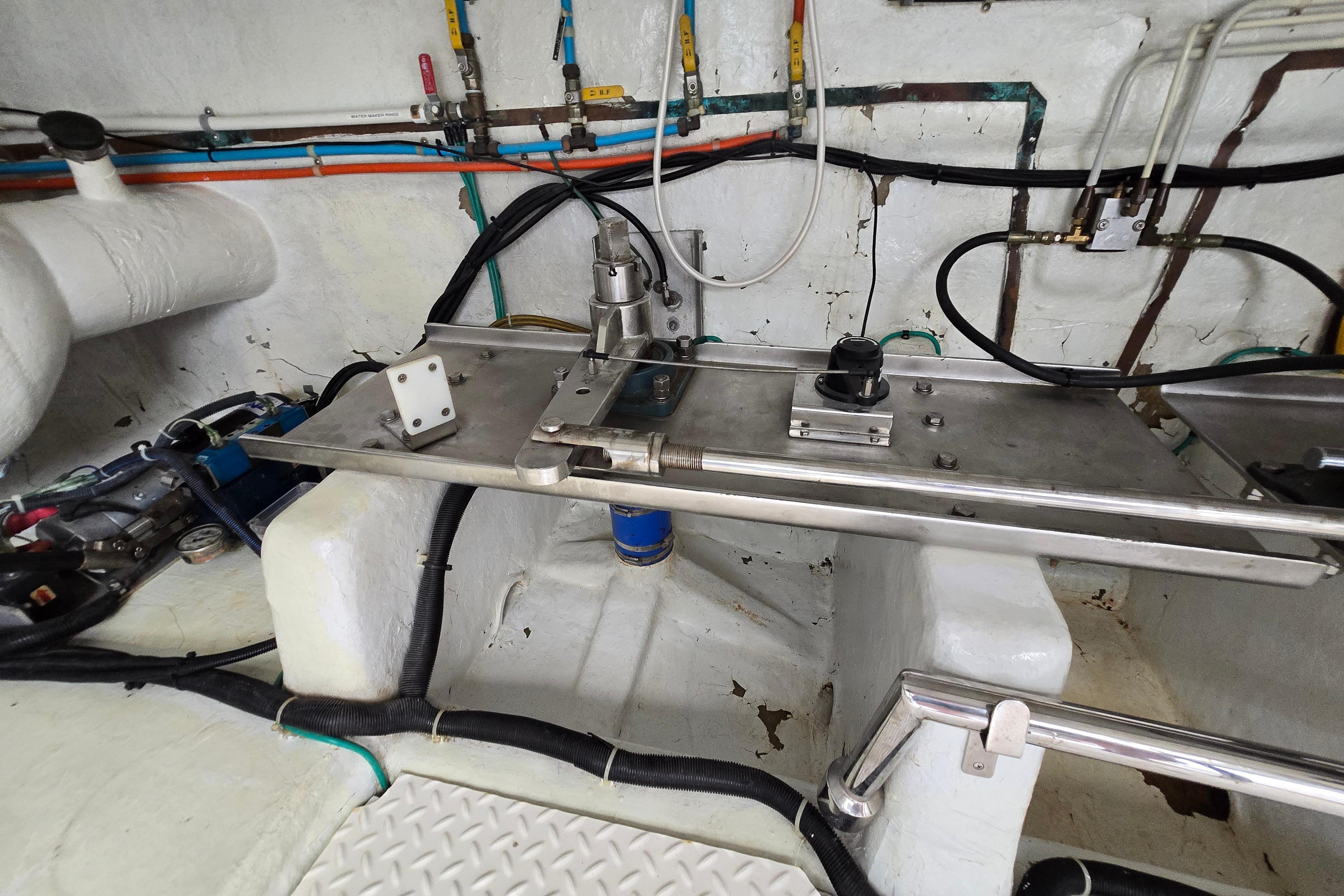 Engine room of a 2004 Grand Harbour 58 yacht, showcasing mechanical components and wiring.