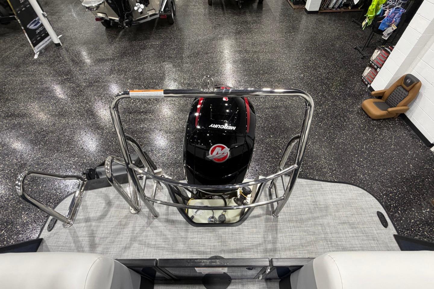 2026 Lowe SS 230 WT boat with Mercury engine in showroom display.