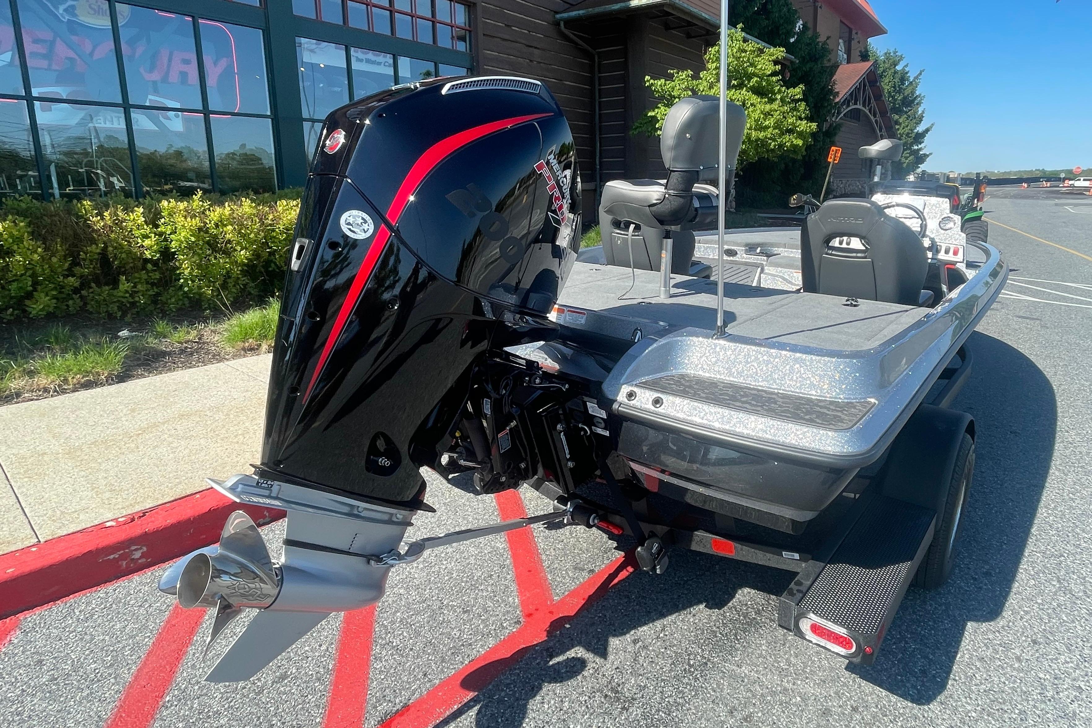 2026 Nitro Z19 XL boat with powerful outboard motor, parked outdoors.