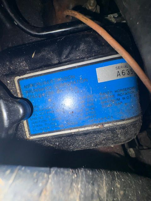 Close-up of a blue nameplate with technical details.