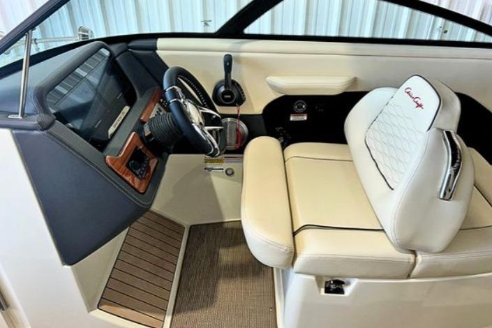 2025 Chris-Craft Sportster 25 cockpit with luxurious seating and modern dashboard design.