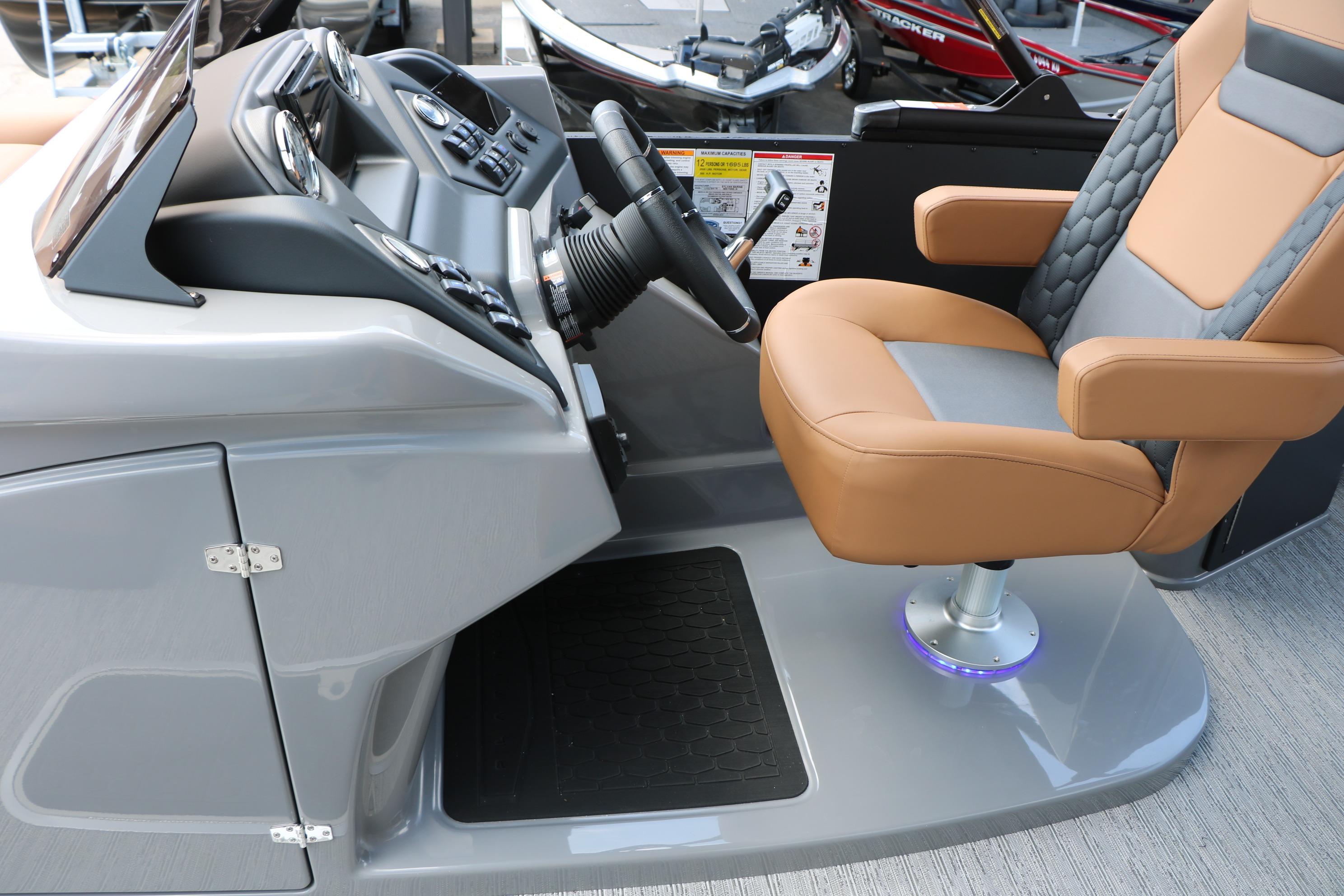 Captain's seat and helm of 2026 Sylvan L3 DLZ Bar Platinum Edition Tri-Toon boat.