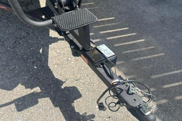 Trailer hitch of 2021 Tracker Pro Team 175 TXW Tournament Edition boat on pavement.