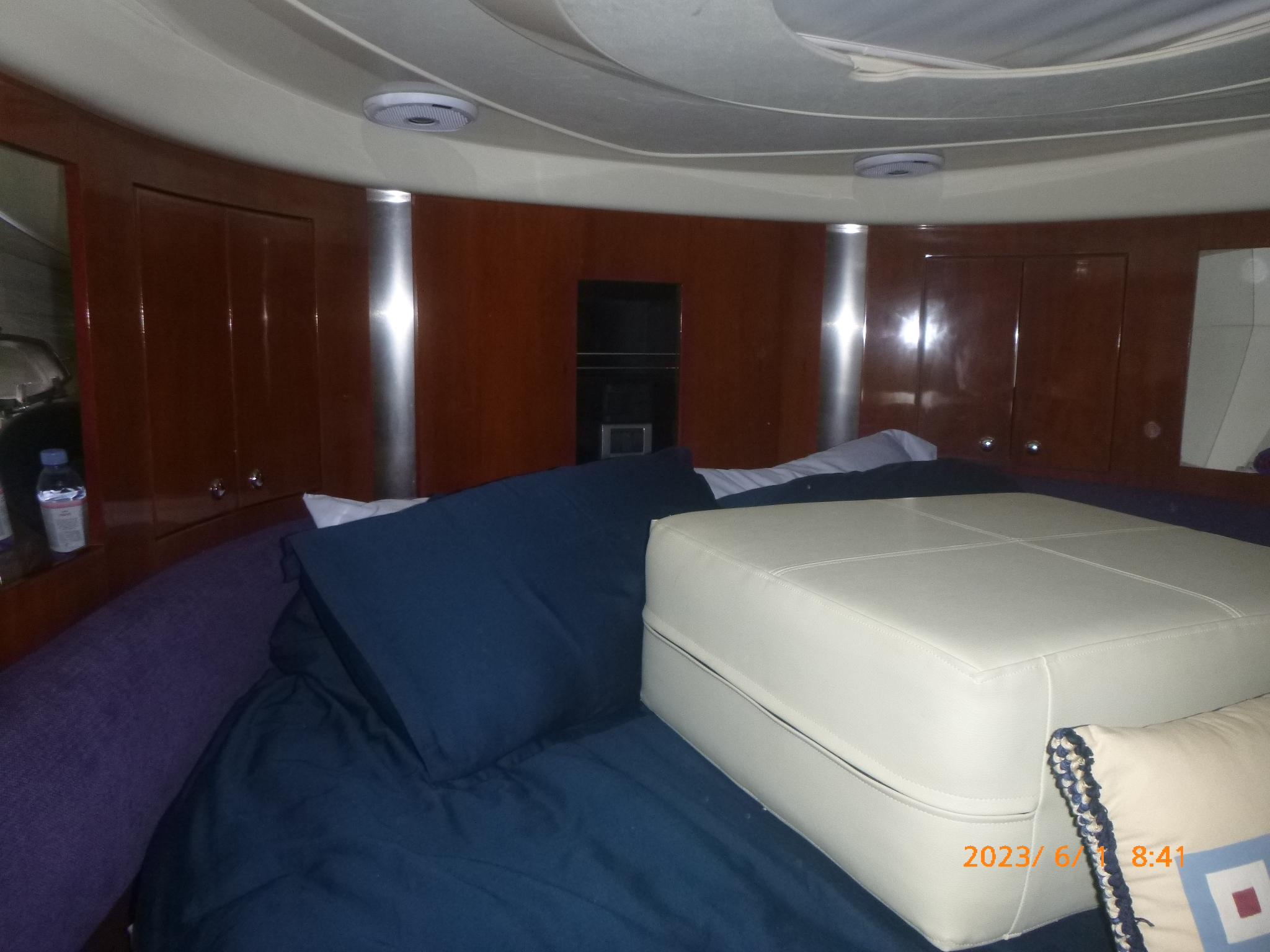 Interior cabin of 2007 Fairline Targa 52 GT yacht with luxurious bedding.