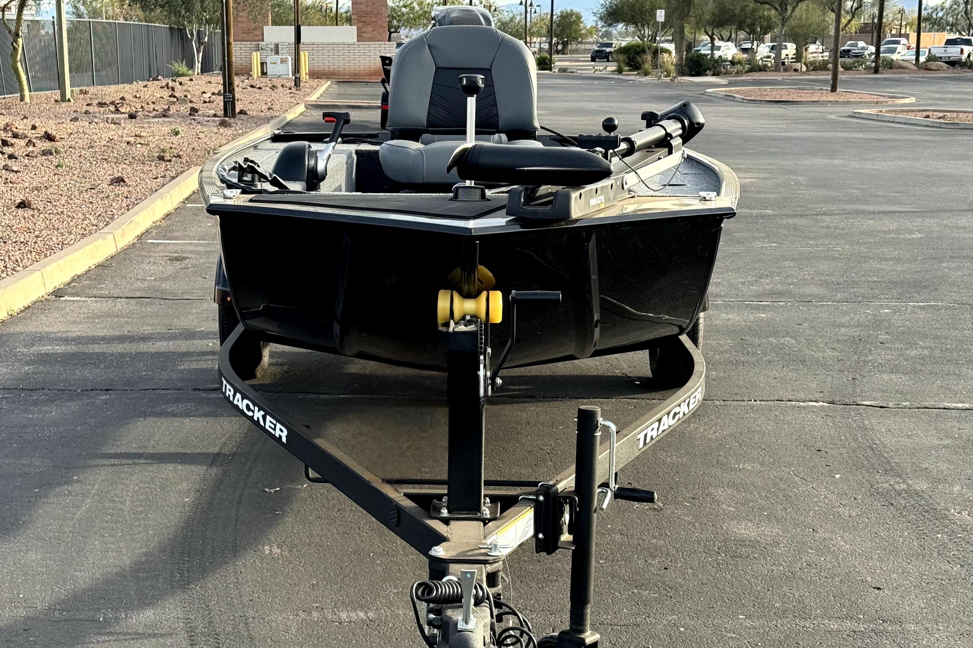 2025 Tracker Panfish 17 boat on trailer in parking lot.
