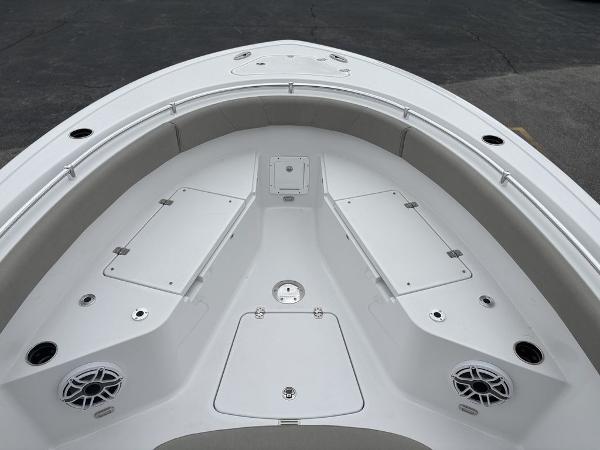 2025 Sportsman Open 232 boat deck with storage compartments and speakers.