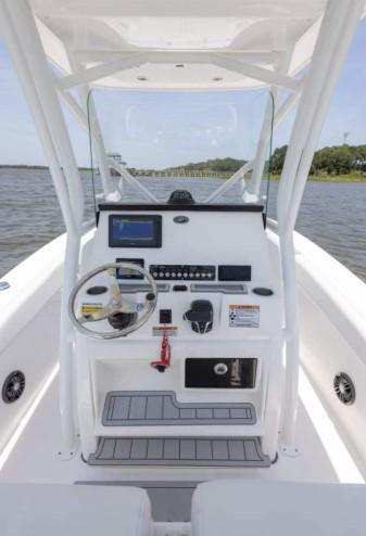 2026 Sea Fox 228 Commander boat console with steering wheel and navigation controls.