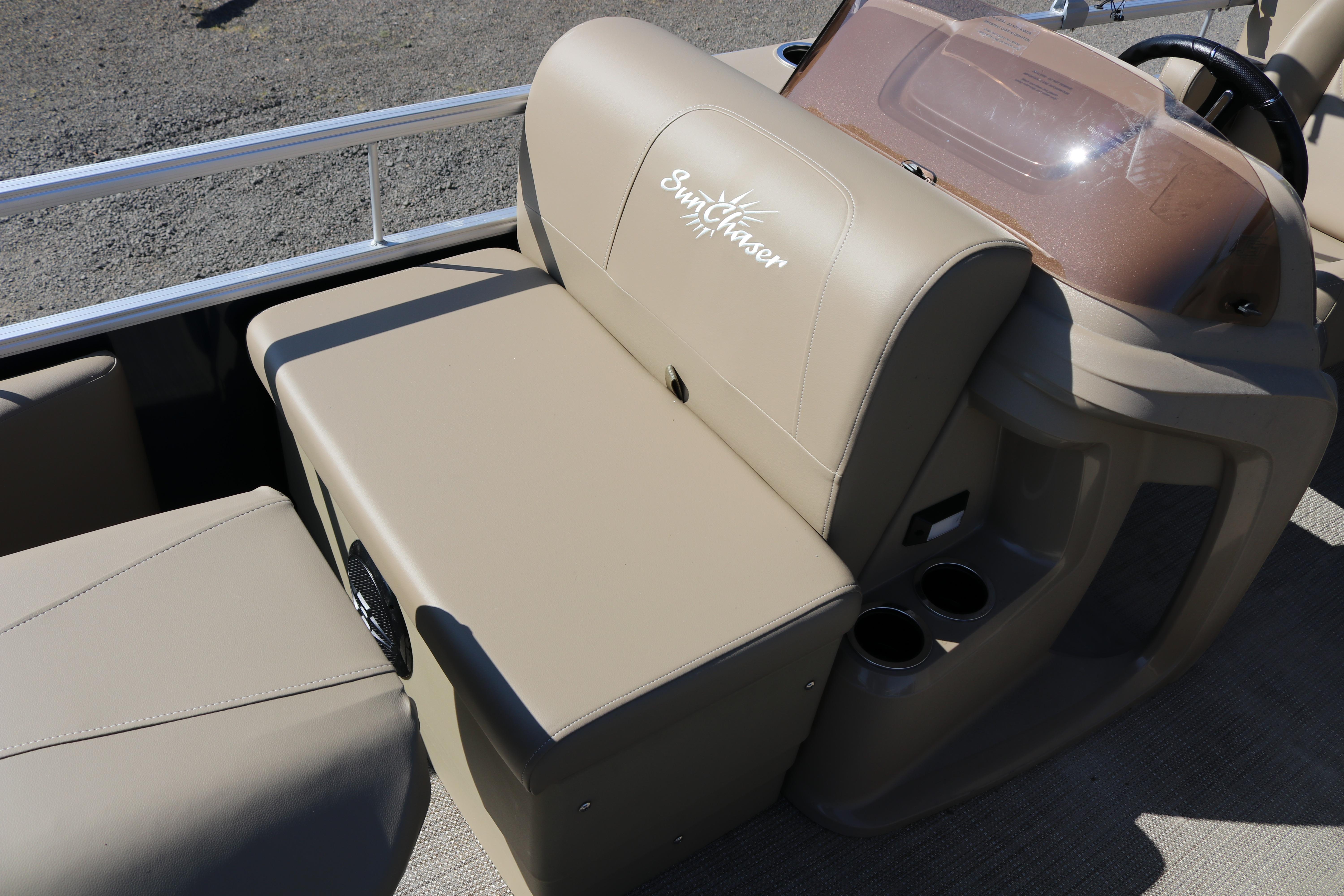 2025 Sun Chaser Vista Fish 18 boat interior with beige seating and cup holders.