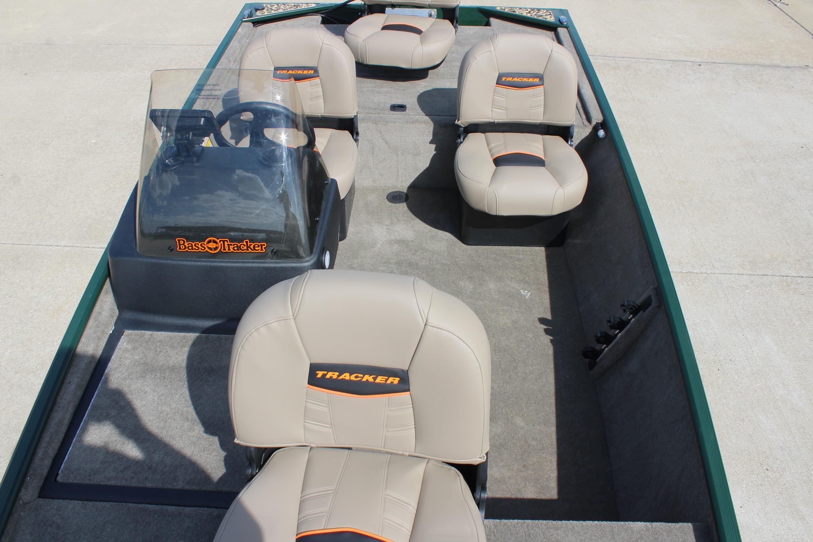 2026 Tracker Bass Tracker Classic Limited boat interior with beige seats and steering console.