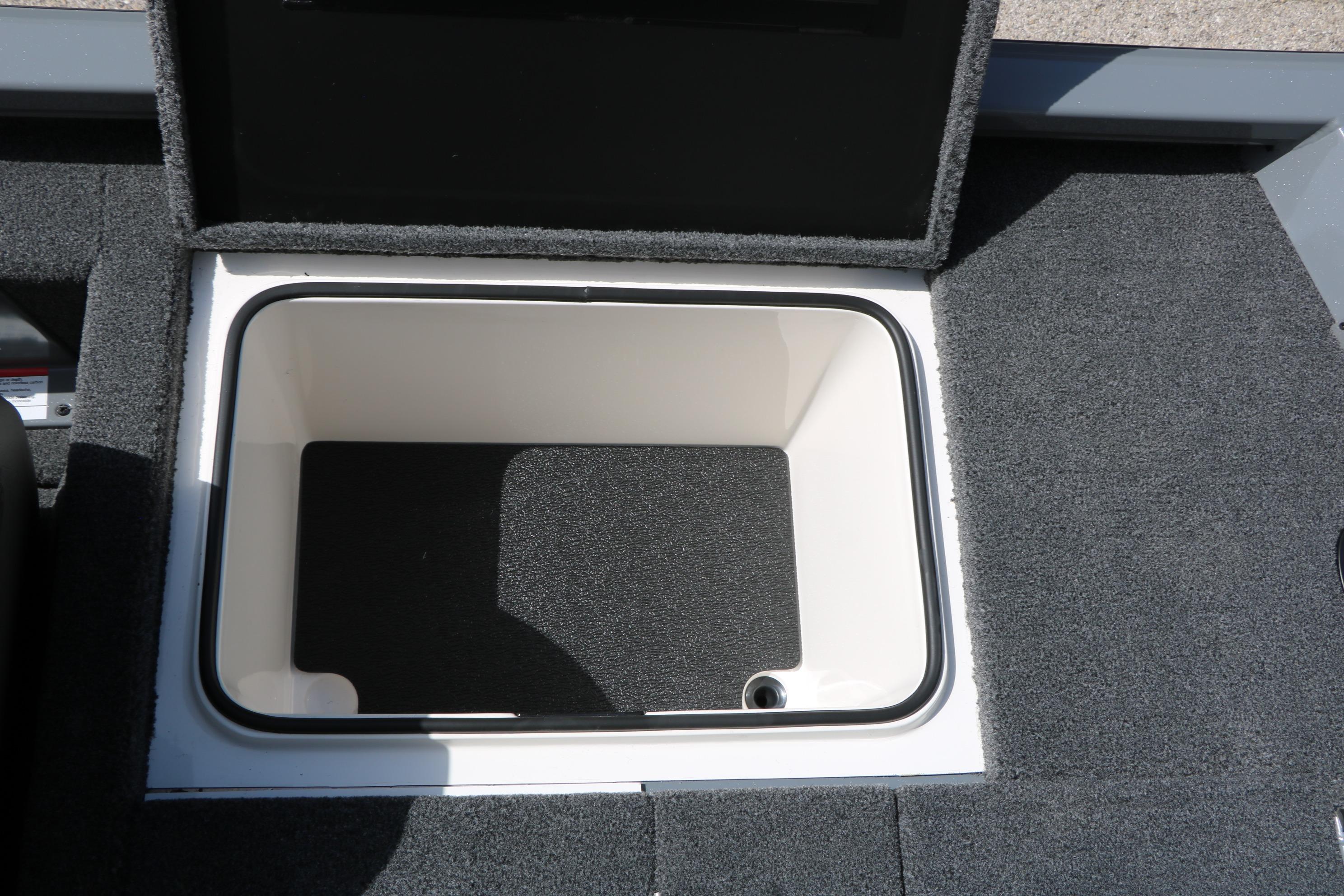 Storage compartment in 2026 Vexus AVX1980 boat, featuring carpeted interior and open lid.