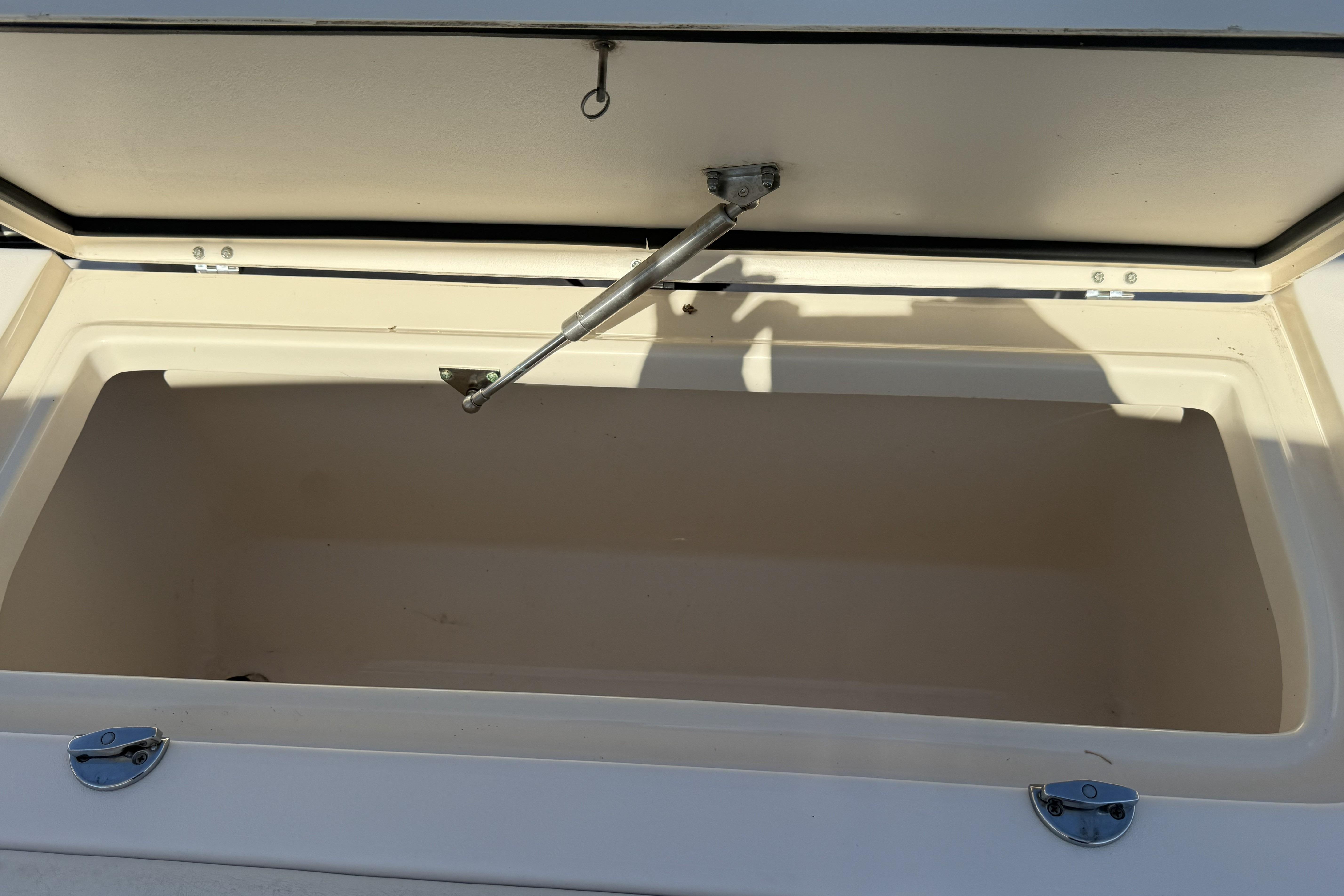 Open storage compartment on a 2014 Grady-White Freedom 275 boat.