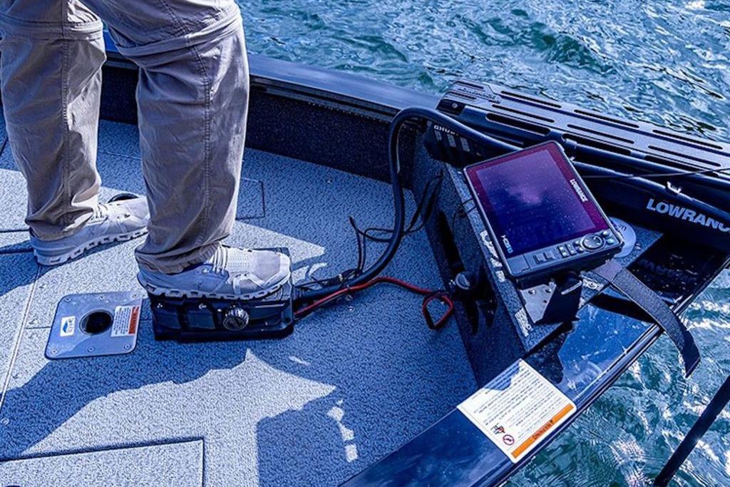 2026 Lowe Fishing Machine 1875 with advanced navigation equipment on deck.