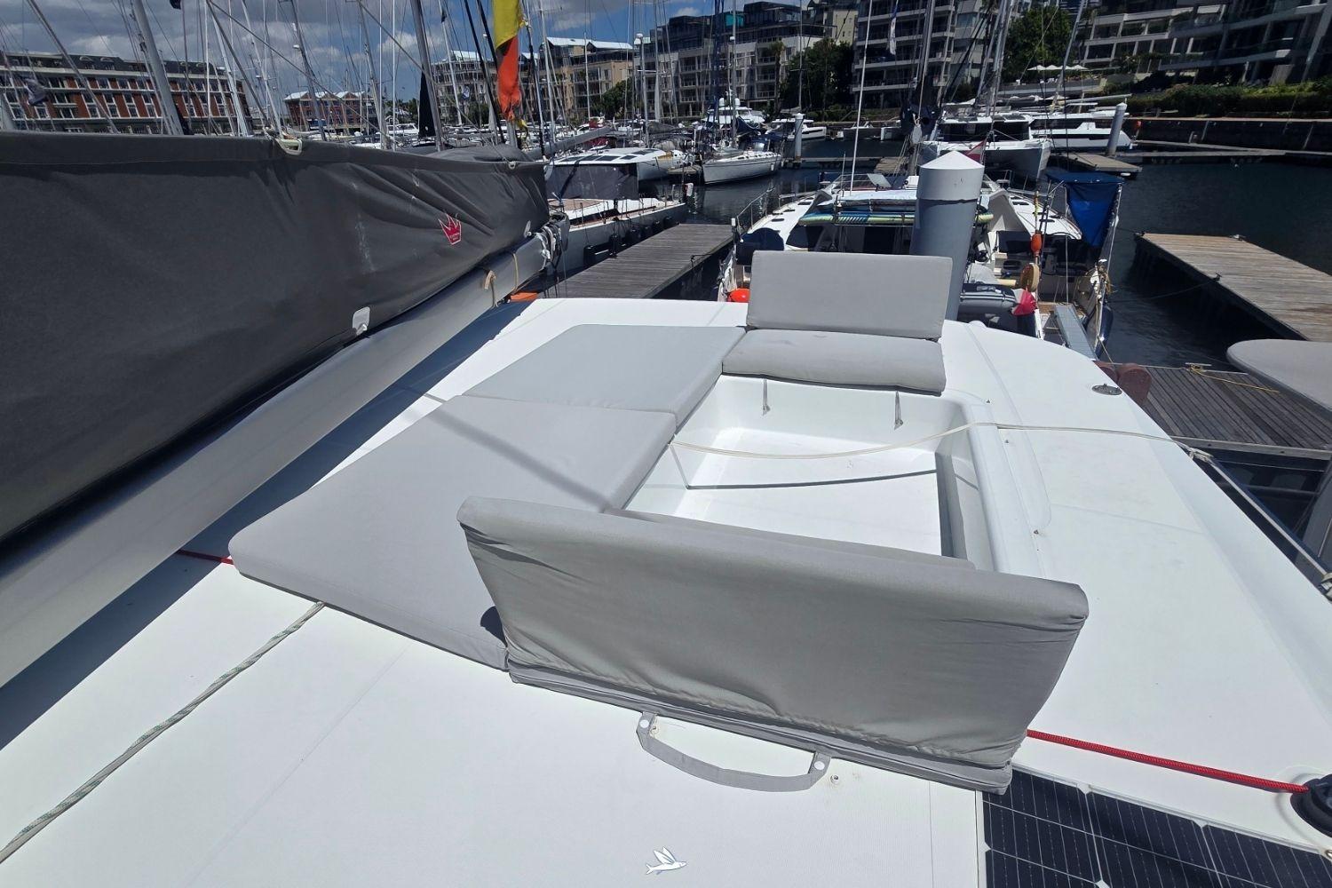 Luxurious 2024 Excess 14 Pulse Line yacht with spacious deck seating in a marina.