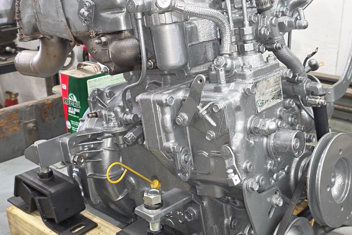 Engine of a 1978 Cape Cod Catboat Ted Brewer, detailed view in workshop.