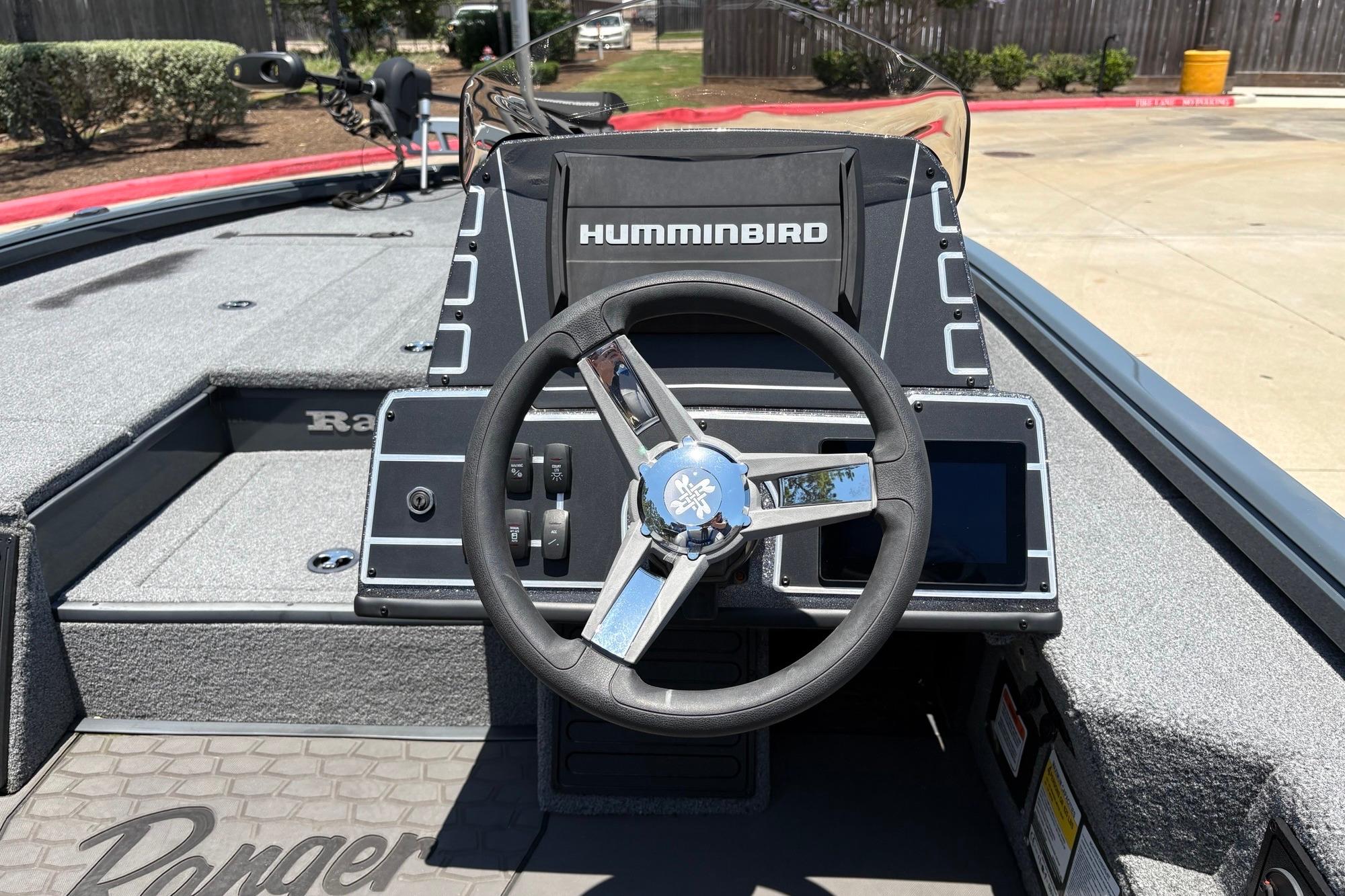 Cockpit of 2025 Ranger ALPHA 208 boat with steering wheel and Humminbird electronics.