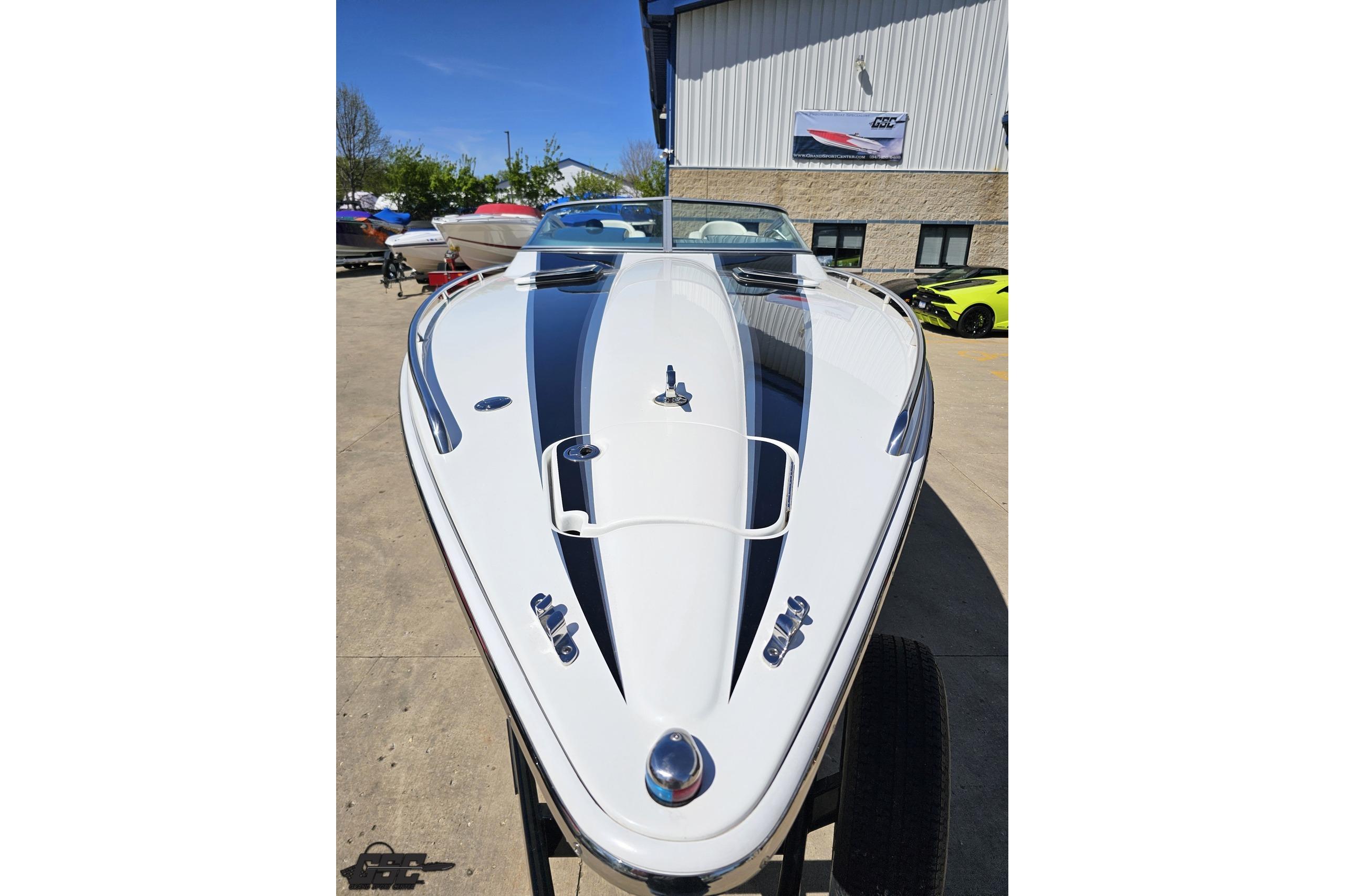2014 Formula 292 FASTech boat with sleek design, parked outdoors on a sunny day.