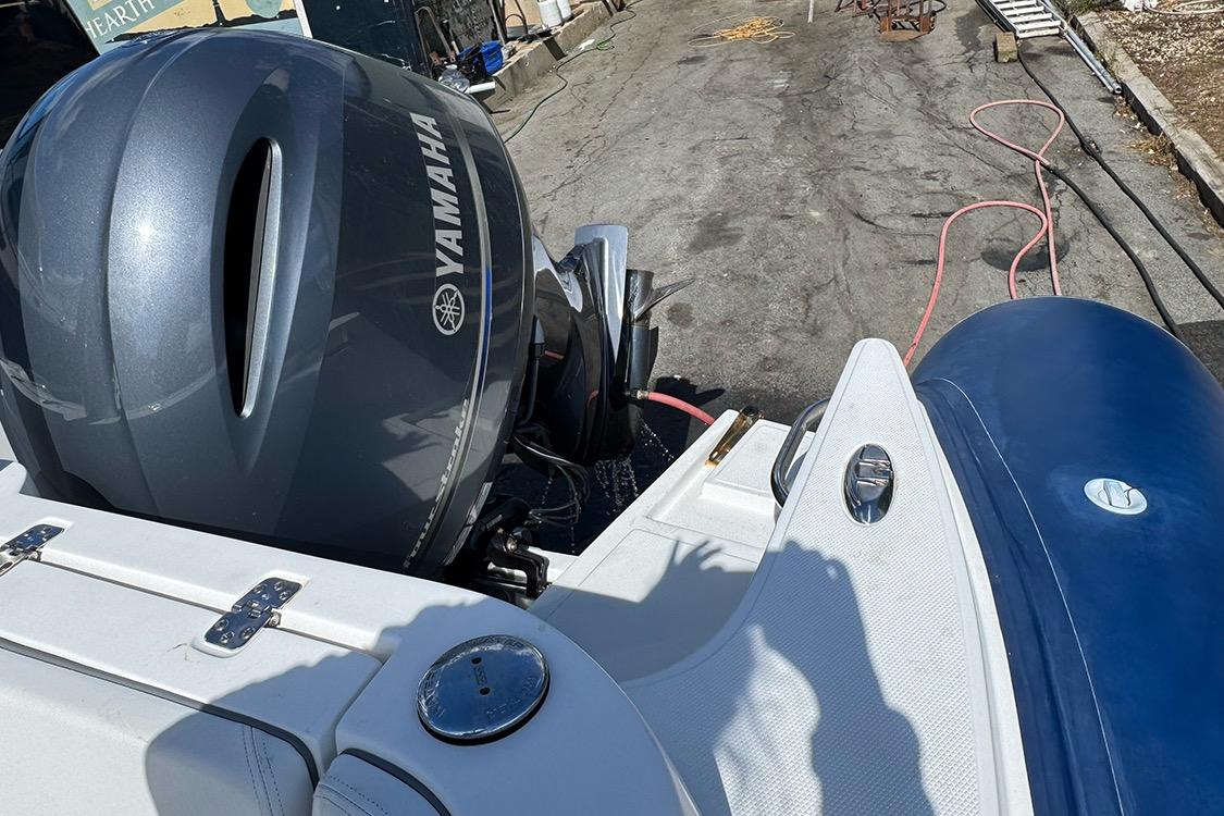 2020 AB Inflatables Oceanus 21 VST with Yamaha outboard engine, docked on pavement.