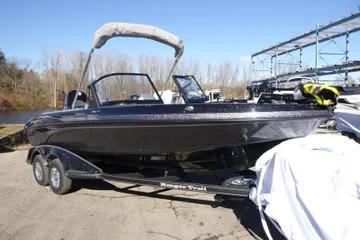 2026 Ranger 2080MS boat on trailer, parked outdoors under clear blue sky.