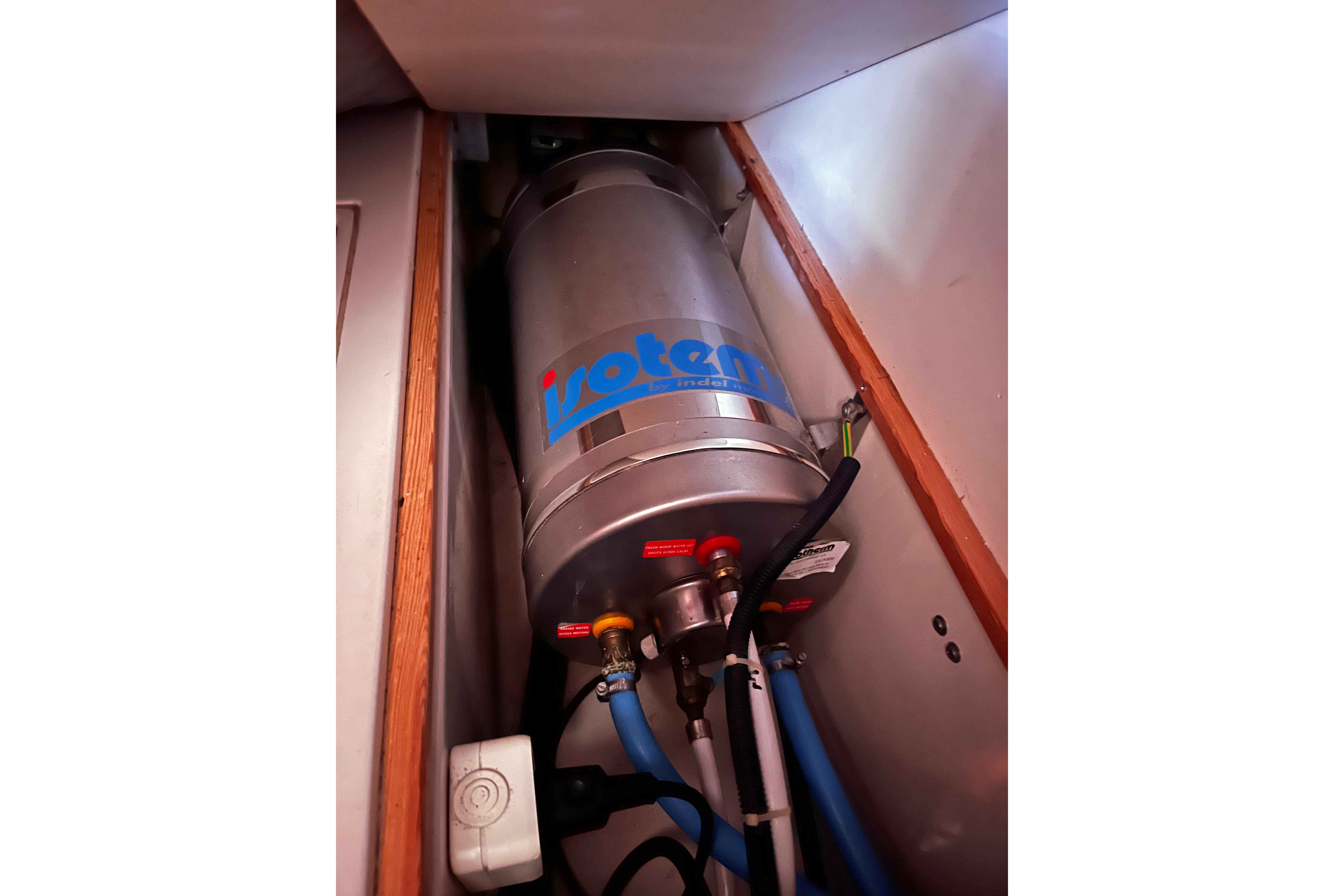 Water heater installation in 2004 Hanse 411 yacht interior compartment.
