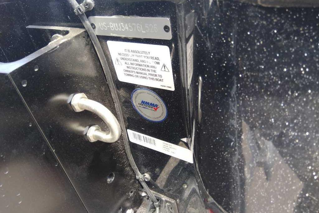 Close-up of a 2026 Nitro Z19 XL Pro boat identification plate and safety labels.