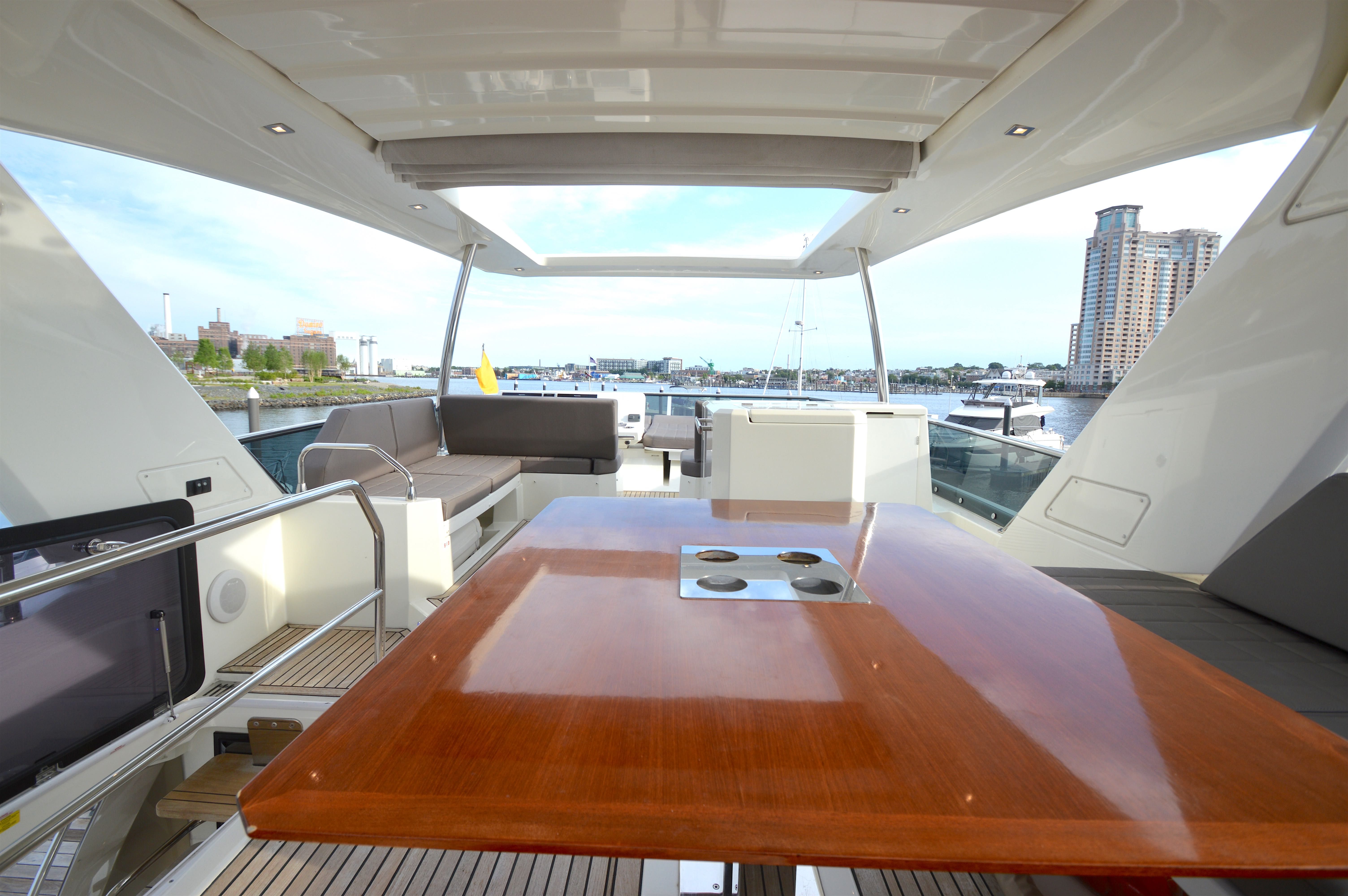 Luxurious interior of a 2017 Prestige 630 yacht in harbor.