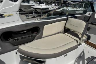 2019 Bryant Calandra 23 boat interior with beige seating and cup holders.